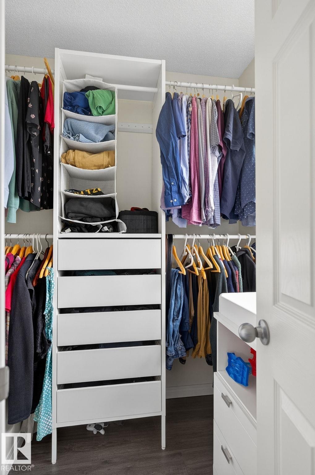 Custom closet system featuring white shelving units - 16 7503 Getty Gate, Edmonton, AB - Indoor With Storage