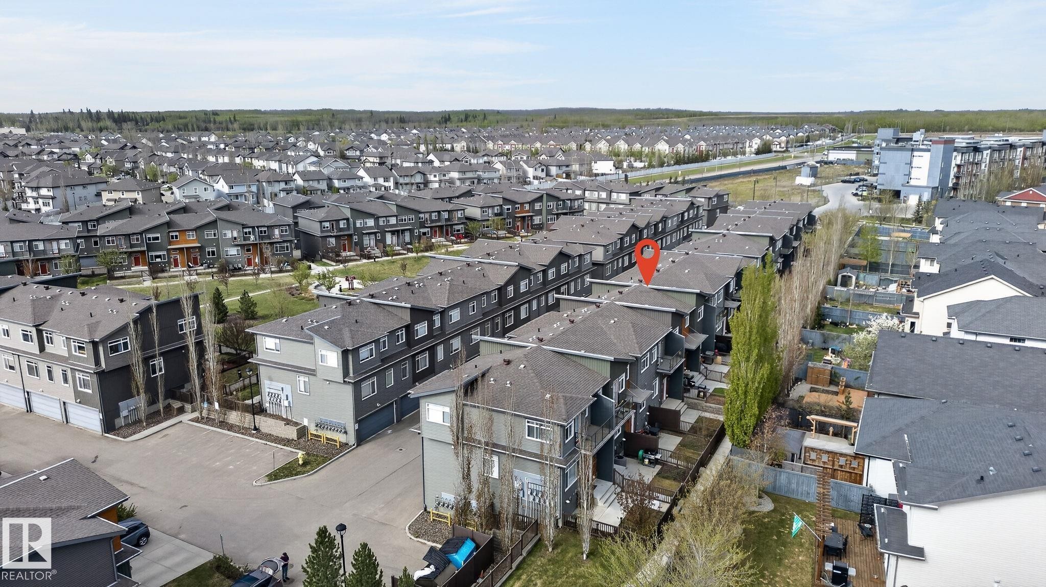 Modern townhome community featuring multi-level units and private balconies - 16 7503 Getty Gate, Edmonton, AB - Outdoor With View