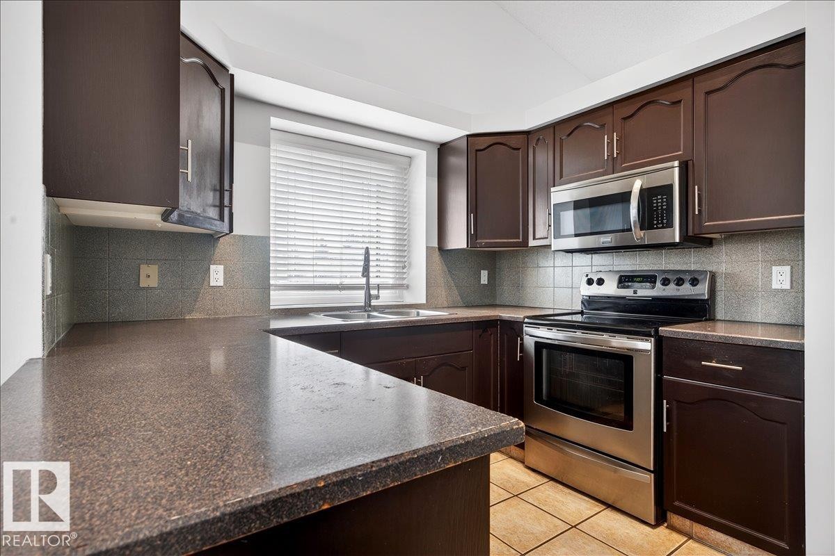 3671 33 Street, Edmonton, AB - Indoor Photo Showing Kitchen With Stainless Steel Kitchen With Double Sink