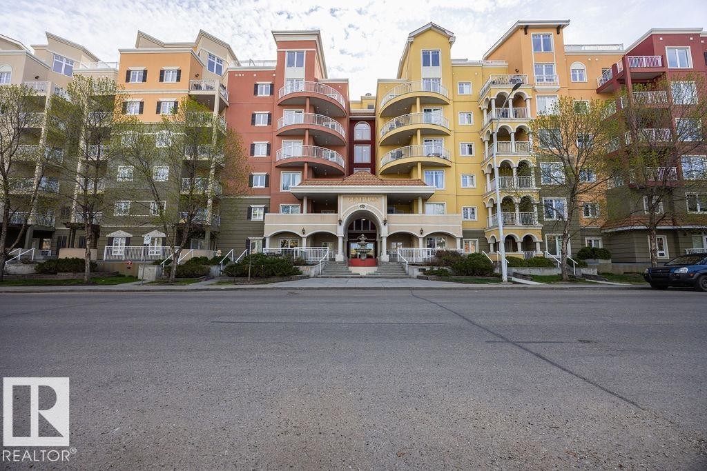 Multi-story residential building featuring varied architectural styles and a colorful facade - #214 10333 112 St Nw, Edmonton, AB - Outdoor With Balcony With Facade