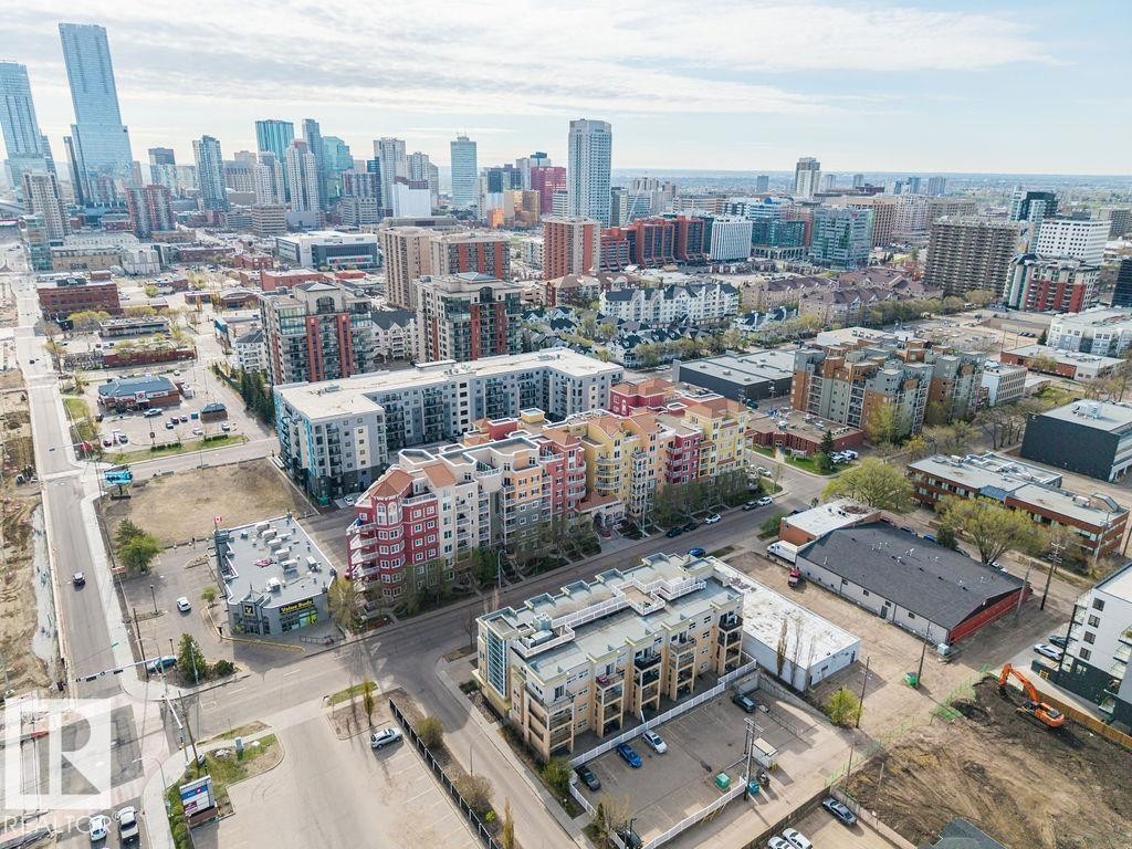 Dense urban setting featuring a mix of residential and commercial buildings - #214 10333 112 St Nw, Edmonton, AB - Outdoor With View