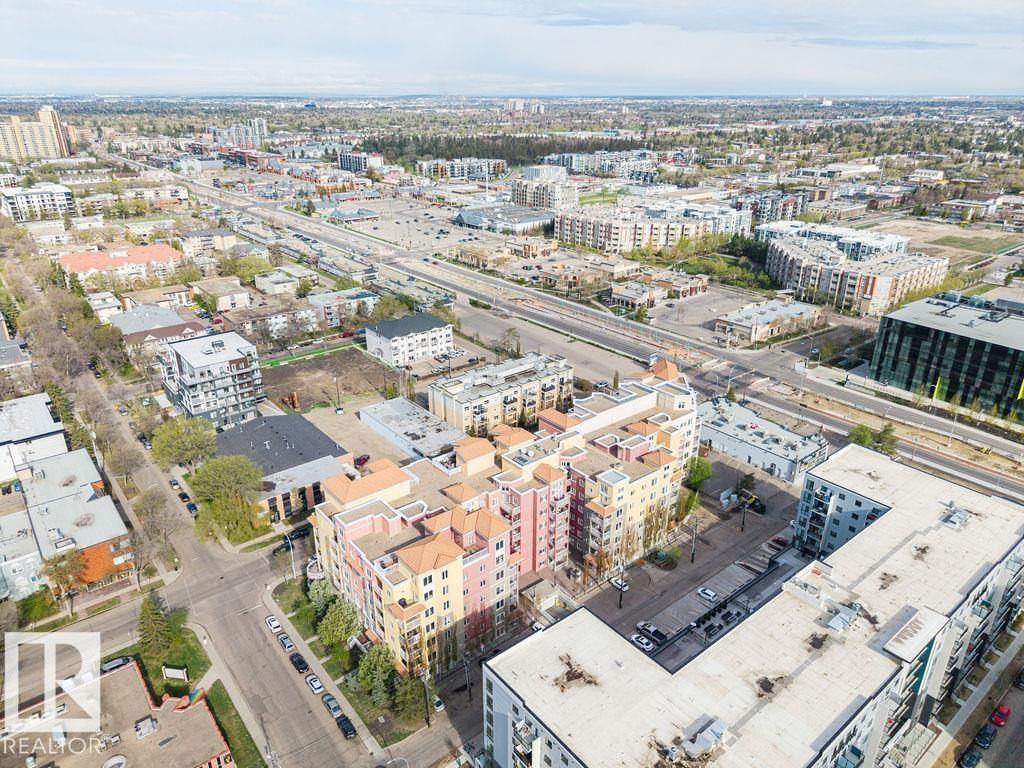 Aerial perspective showcasing an urban landscape with diverse architectural styles - #214 10333 112 St Nw, Edmonton, AB - Outdoor With View