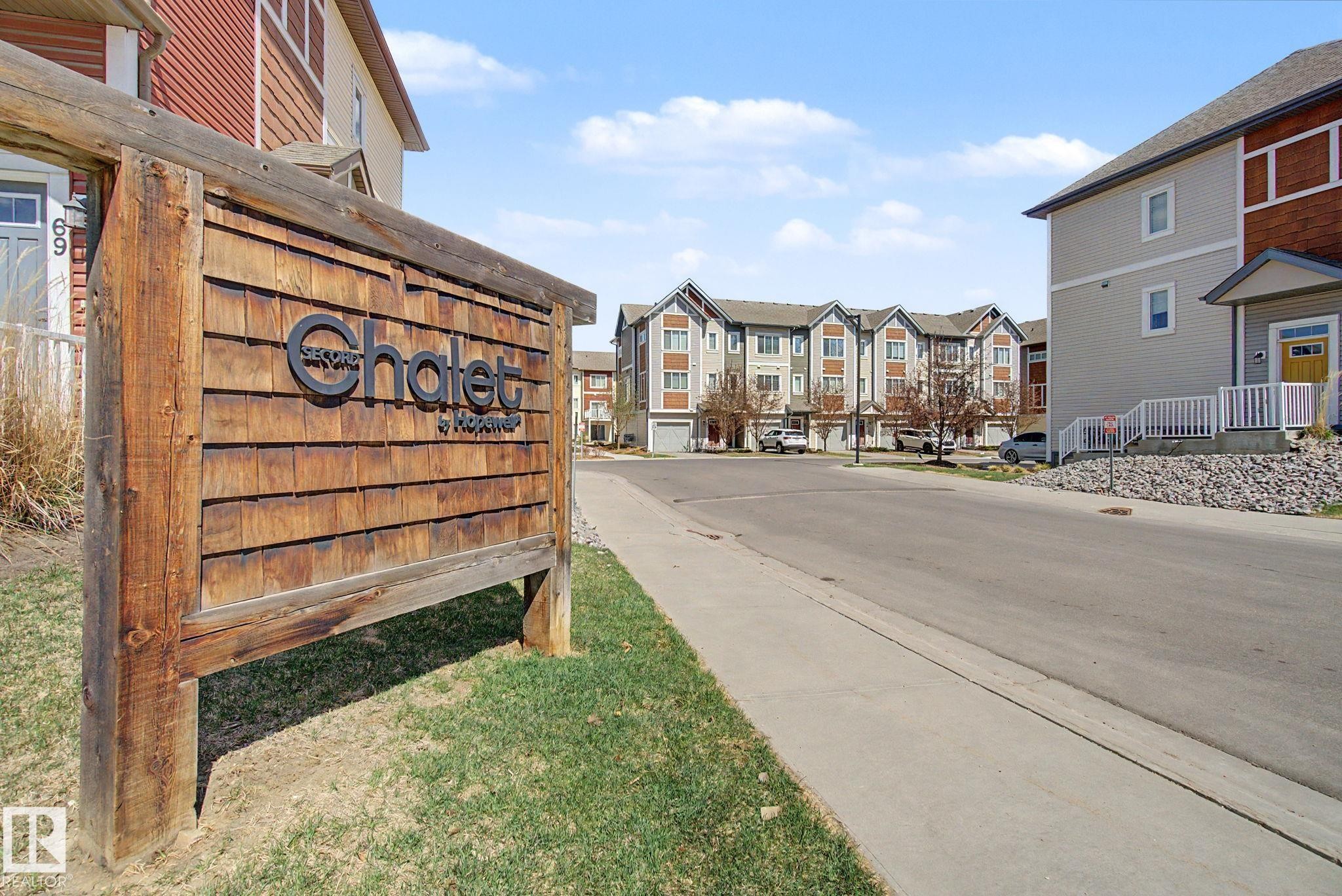 Rustic wood-shingle signage with dimensional lettering - 17 320 Secord Boulevard, Edmonton, AB - Outdoor