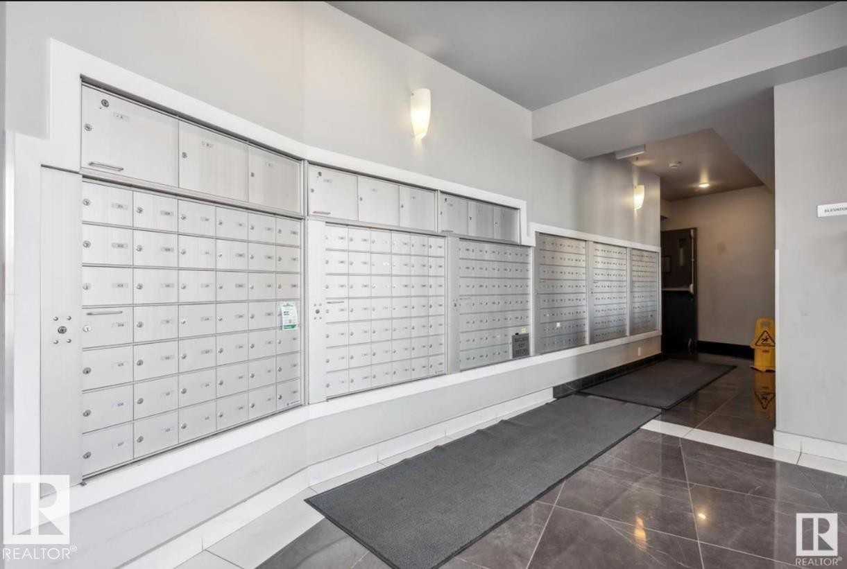 Mailbox area featuring multiple secure individual units - 531 5151 Windermere Boulevard, Edmonton, AB - Indoor Photo Showing Other Room
