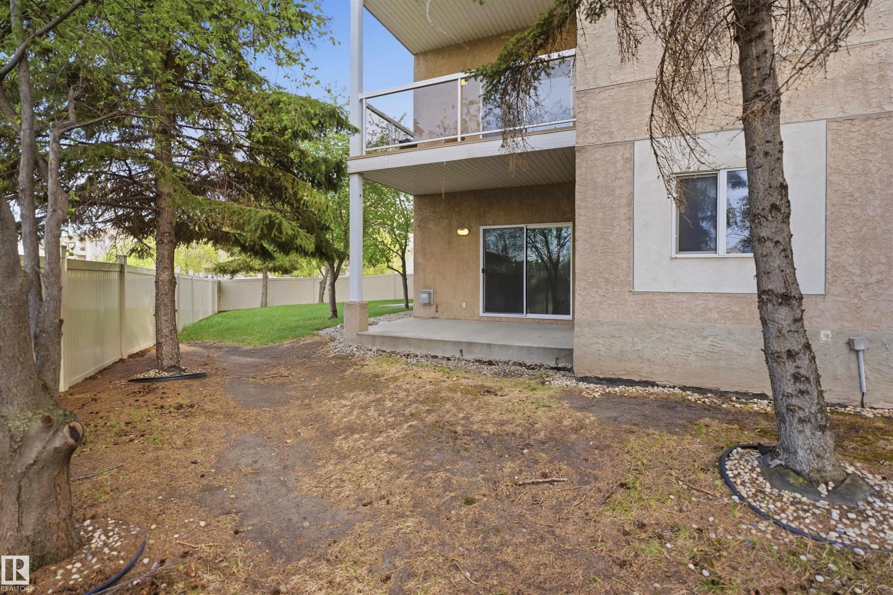 Ground-floor patio with a sliding glass door entry - 124 10511 42 Avenue, Edmonton, AB