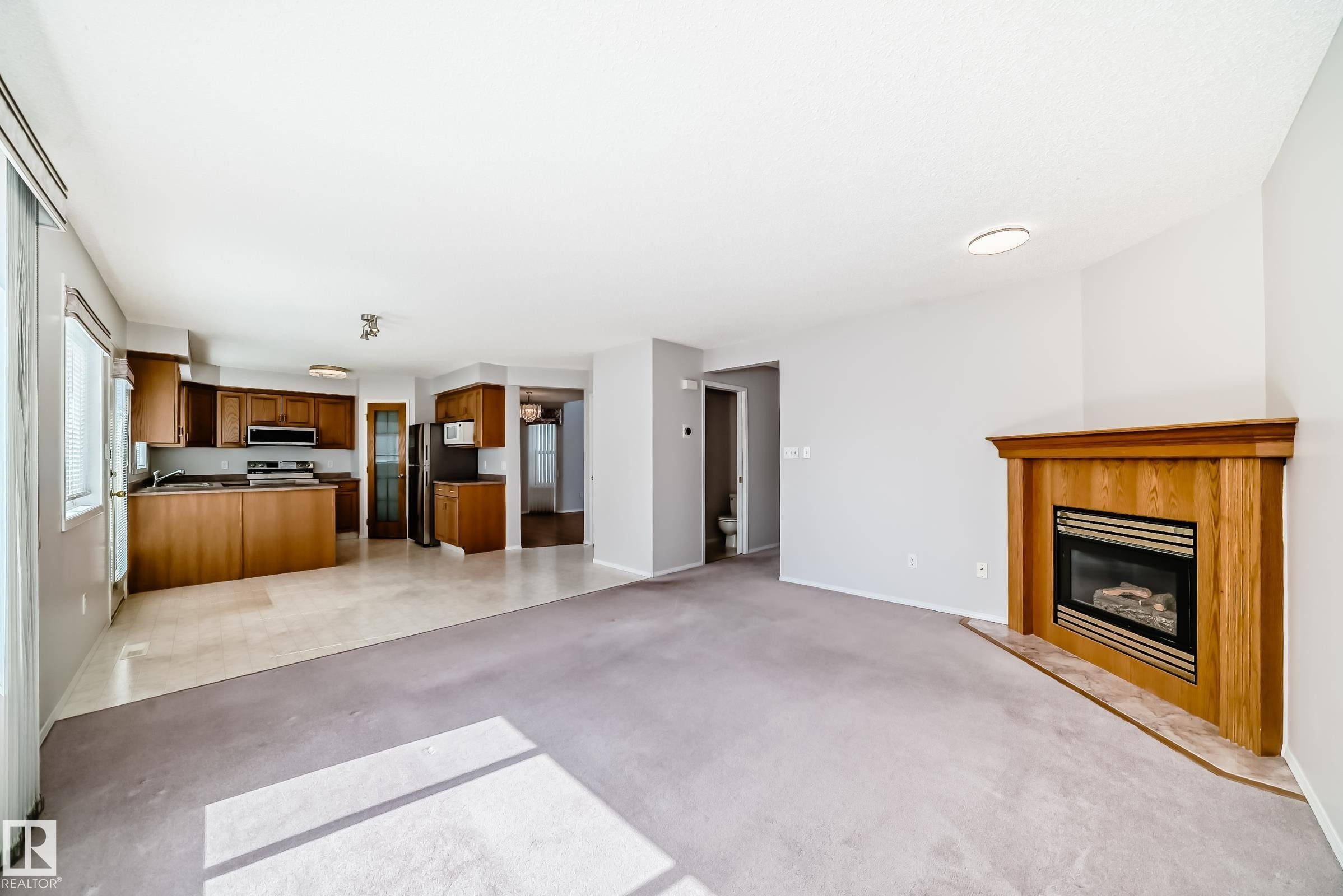 4319 39 Avenue, Edmonton, AB - Indoor Photo Showing Living Room With Fireplace
