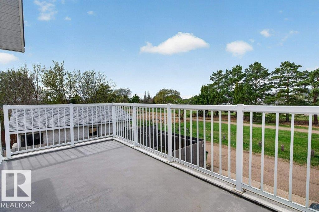 Private outdoor balcony featuring a concrete surface and white metal railing - 157 Kiniski Crescent, Edmonton, AB - Outdoor With Deck Patio Veranda