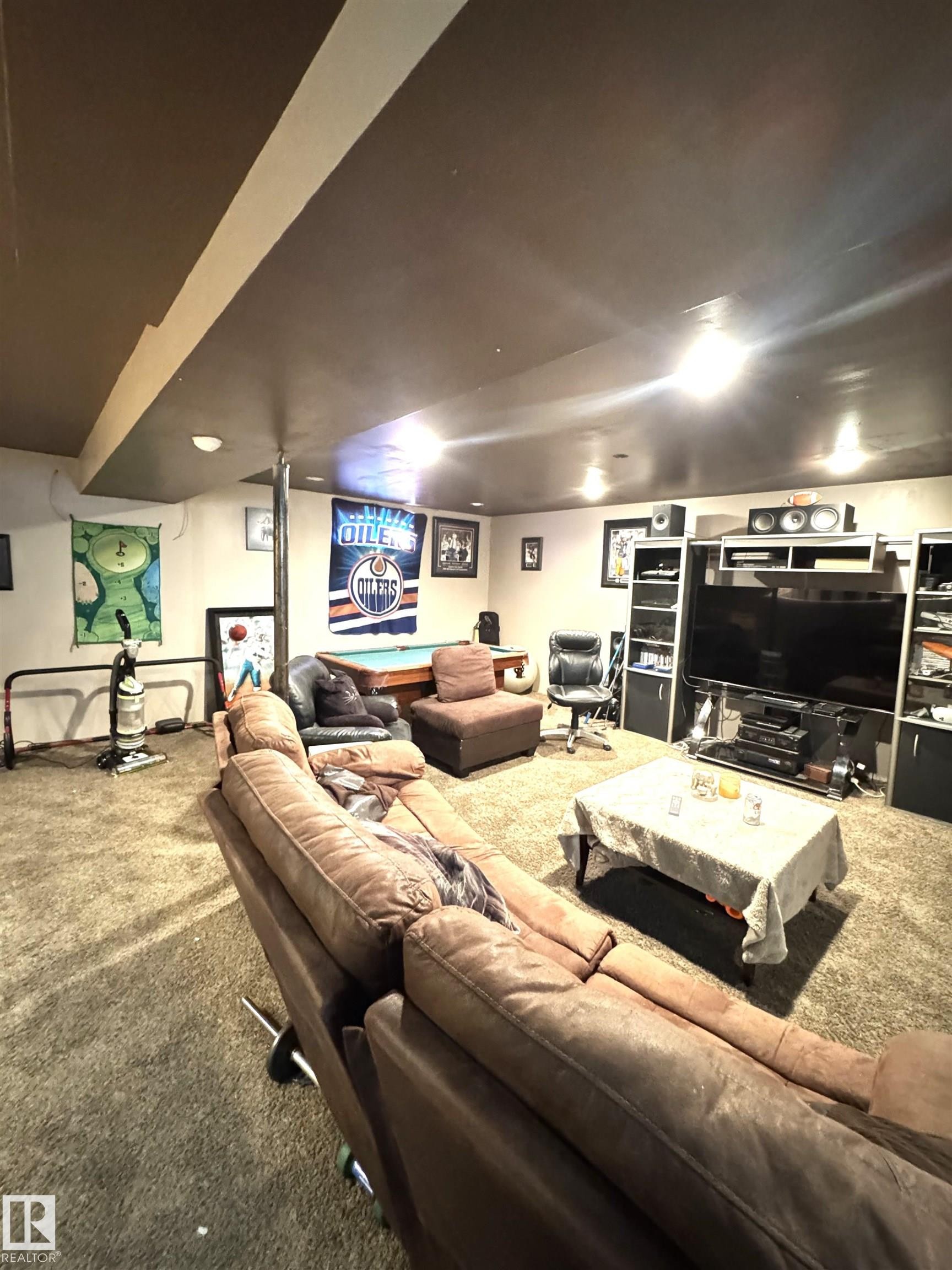 Spacious room featuring carpeting, recessed lighting, and a dark-painted ceiling - 45 Lambert Crescent, St. Albert, AB - Indoor