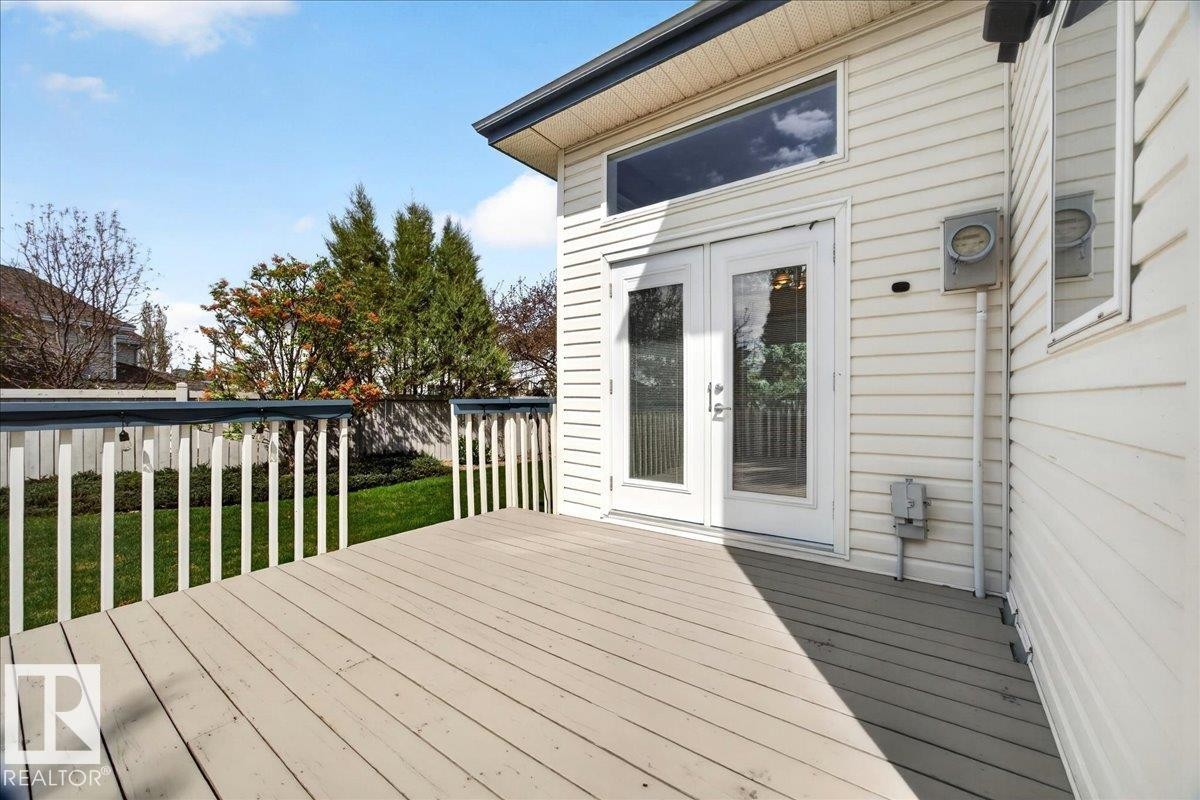 Outdoor deck featuring painted wood planks and white balusters - 11824 13 Avenue, Edmonton, AB - Outdoor With Deck Patio Veranda With Exterior