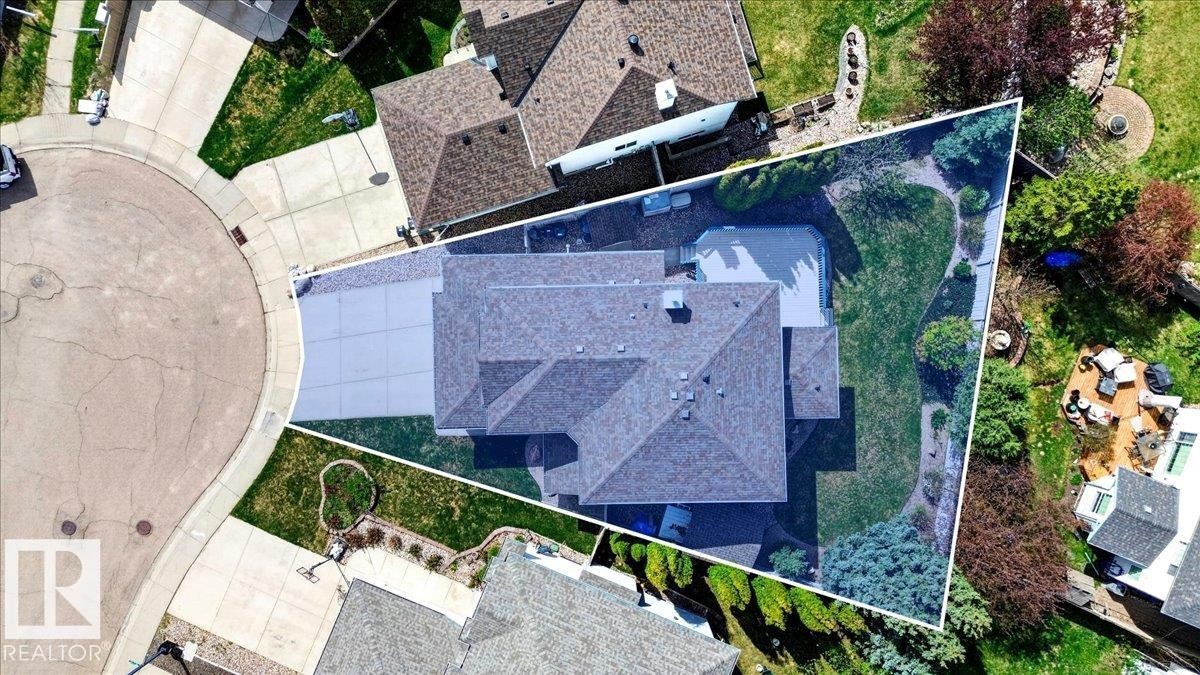 Spacious property featuring a large asphalt shingle roof, extensive driveway, and a generously sized rear yard with mature landscaping and a visible swimming pool - 11824 13 Avenue, Edmonton, AB - Outdoor With Exterior