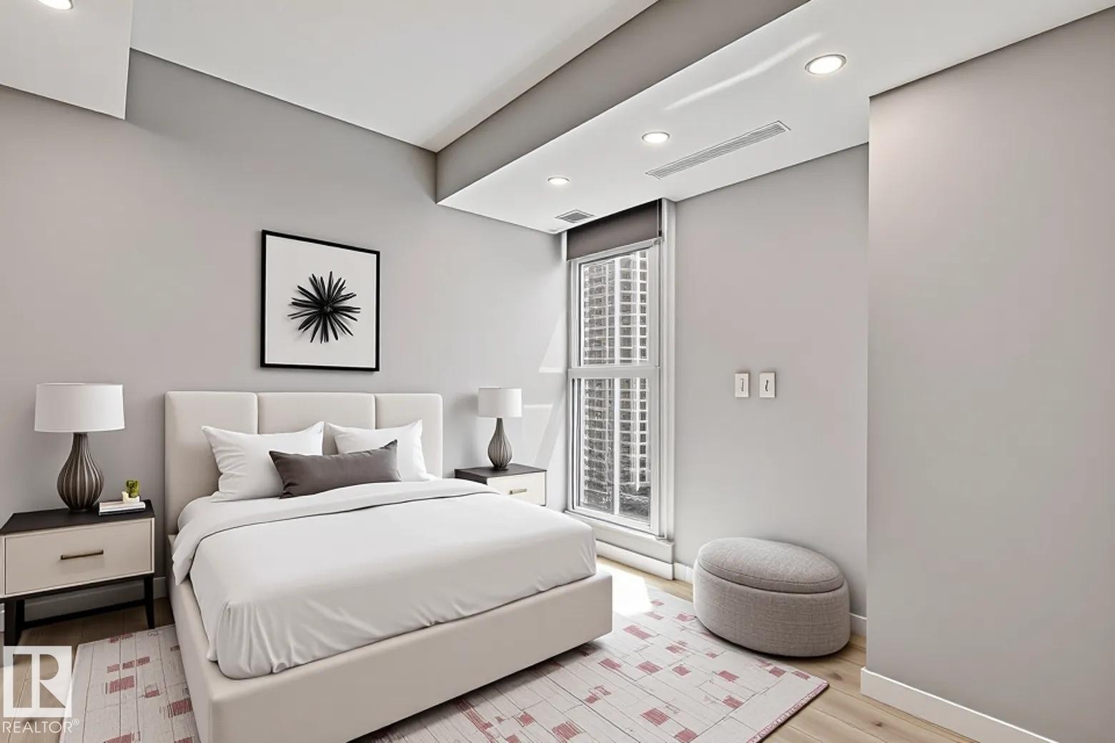 Contemporary bedroom featuring light wood-finish flooring and recessed ceiling lighting - #1601 10180 103 St Nw, Edmonton, AB - Indoor Photo Showing Bedroom