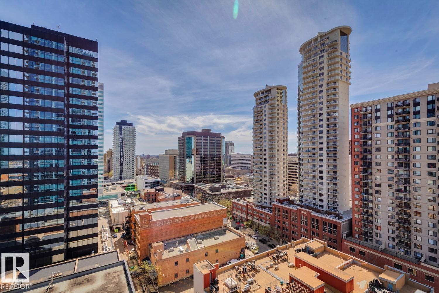 Urban skyline featuring varied architectural styles and multiple high-rise structures - #1601 10180 103 St Nw, Edmonton, AB - Outdoor With Facade