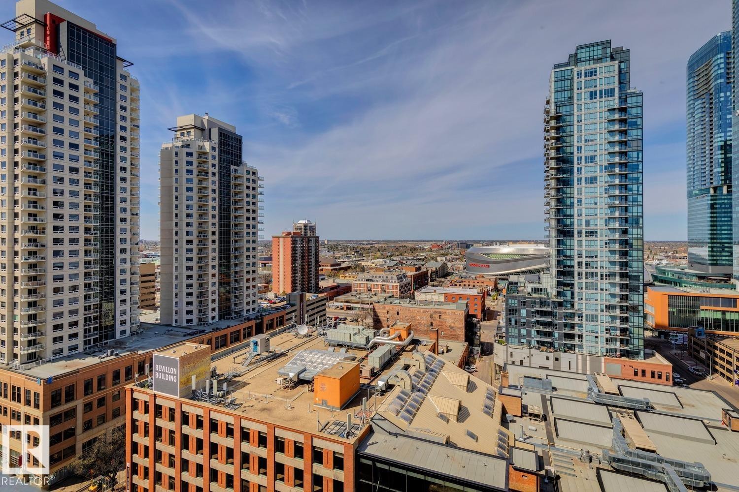 Skyline with multiple high-rise residential buildings and distant architectural structures - #1601 10180 103 St Nw, Edmonton, AB - Outdoor With Facade