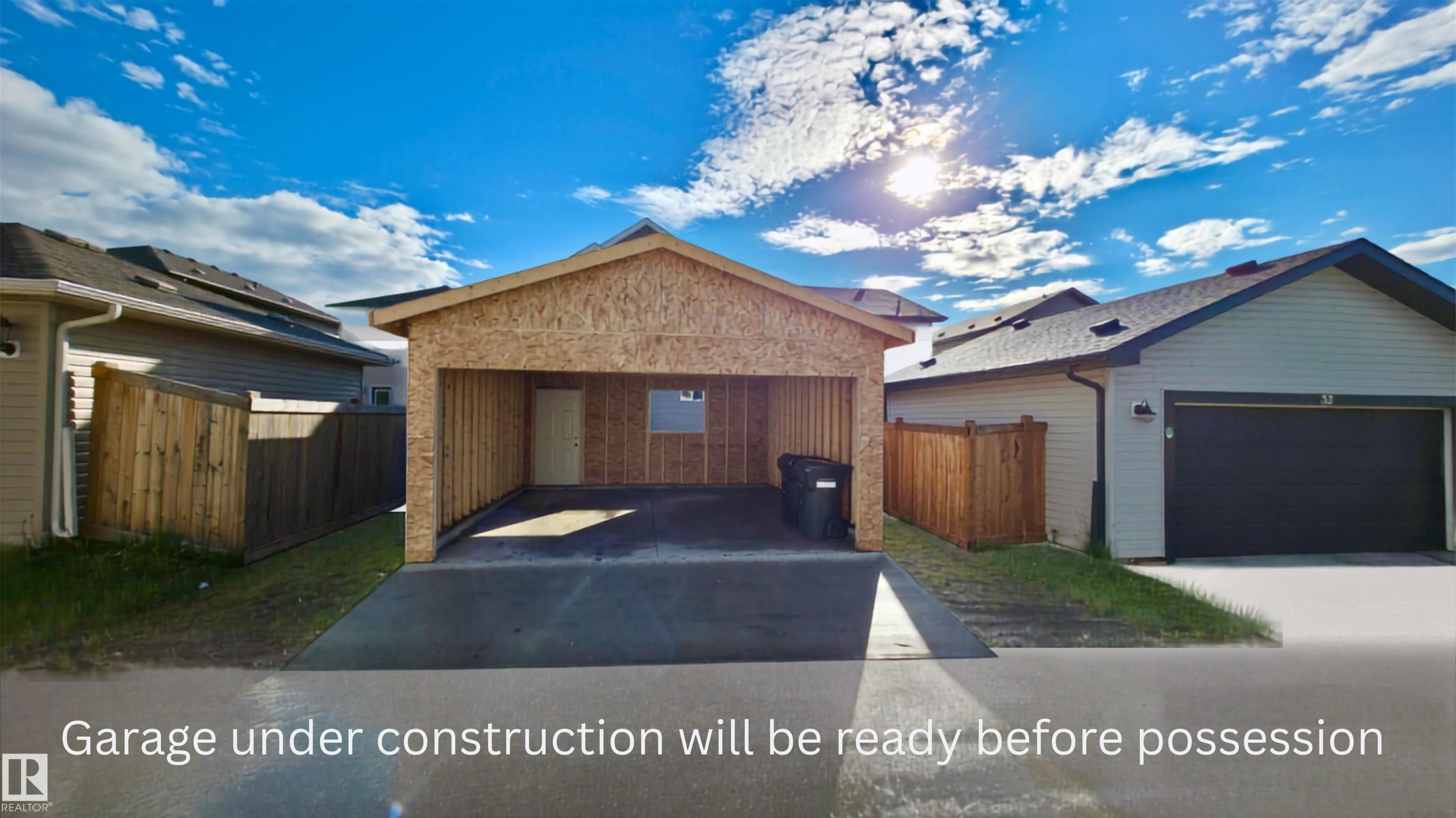 Under-construction attached garage with a concrete driveway - 30 Hope Cm, Spruce Grove, AB - Outdoor With View