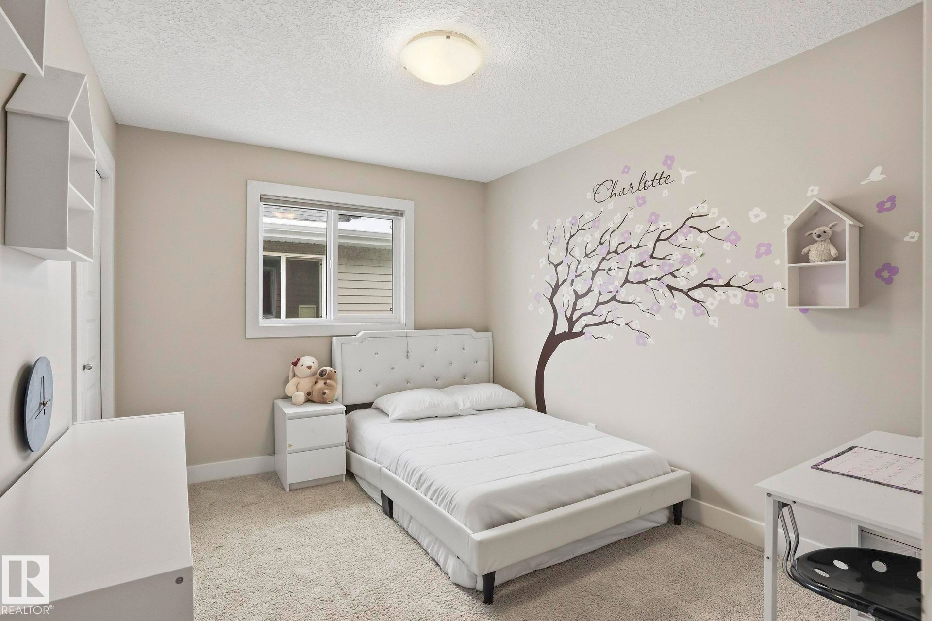 Bedroom featuring carpet flooring and a textured ceiling - 1915 77 Street, Edmonton, AB - Indoor Photo Showing Bedroom