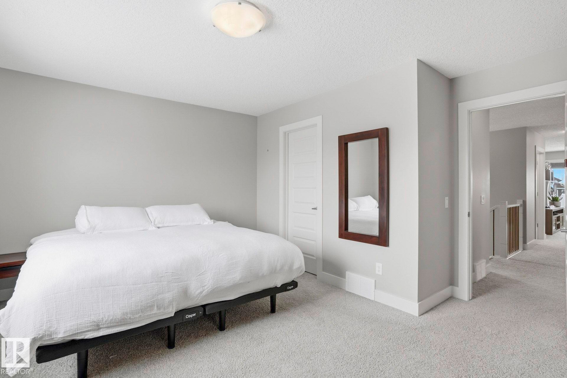 Bedroom featuring carpet flooring and a textured ceiling - 1915 77 Street, Edmonton, AB - Indoor Photo Showing Bedroom
