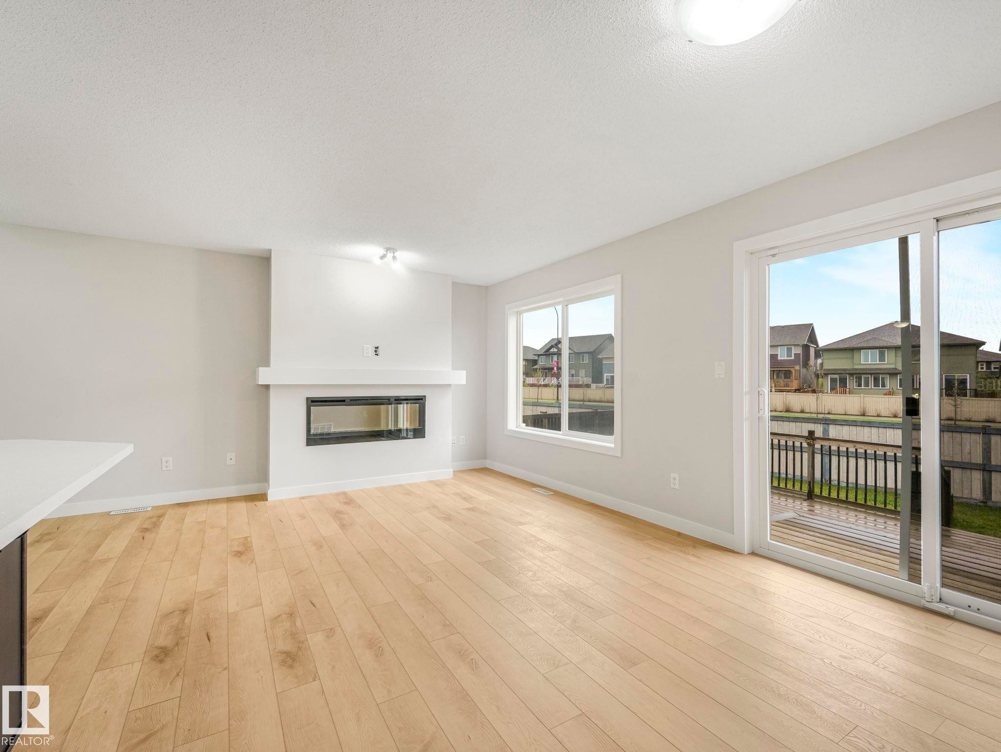 7327 24 Avenue, Edmonton, AB - Indoor Photo Showing Living Room With Fireplace