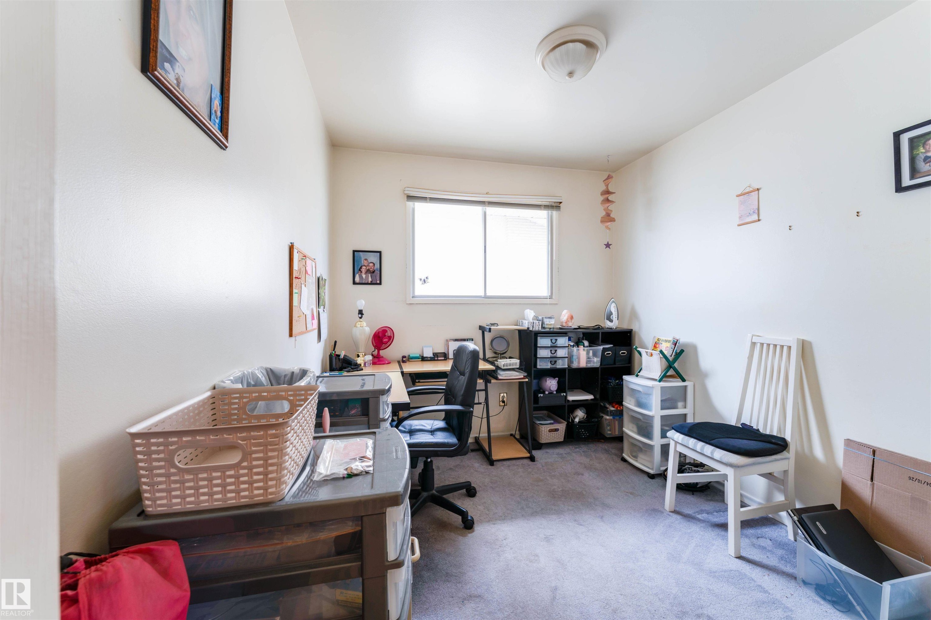 Room featuring a window with a white frame, overhead dome lighting, and light-toned walls - 13231 74 Street, Edmonton, AB - Indoor Photo Showing Office