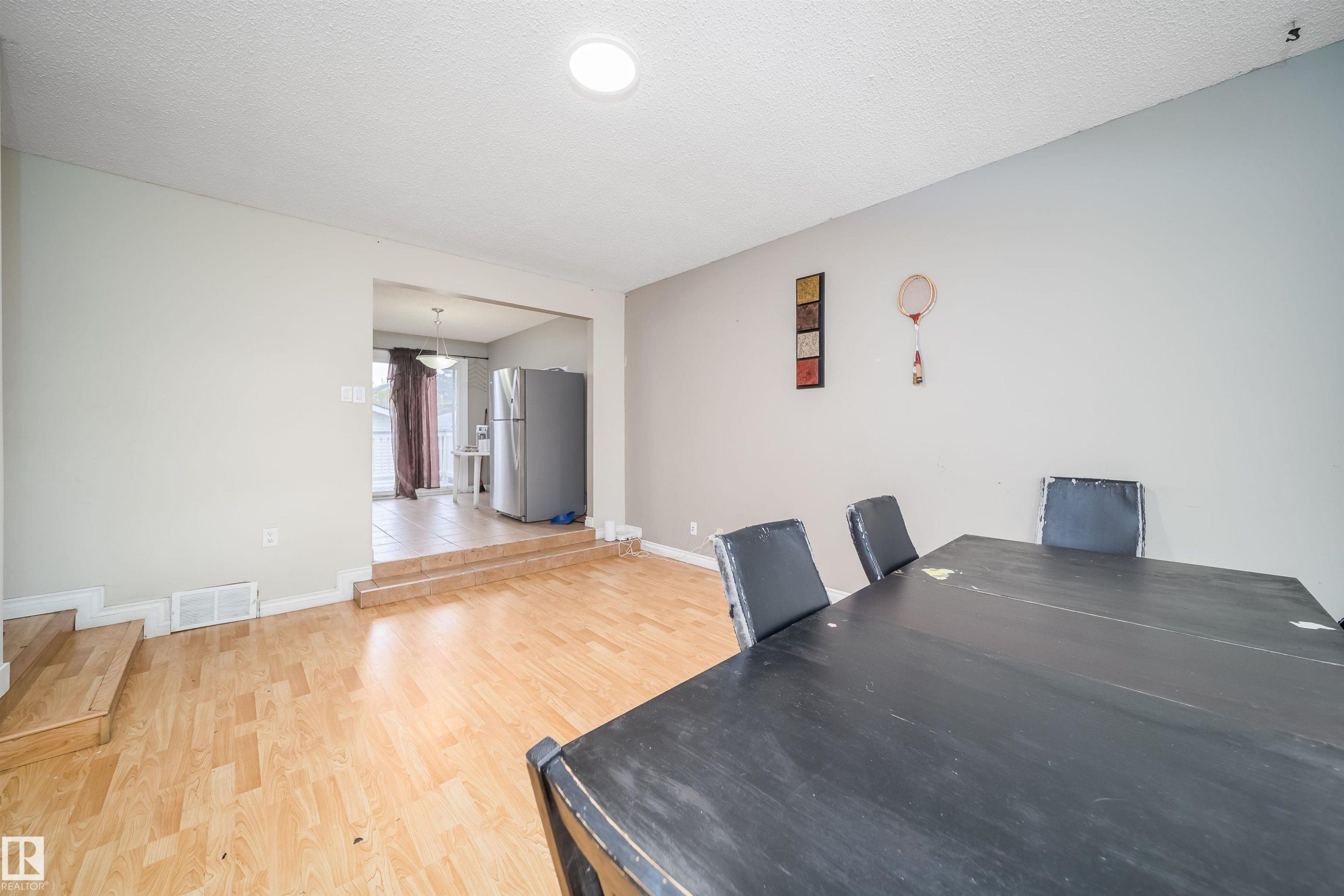 Open-concept dining area featuring light wood-finish flooring - 1771 37 Street, Edmonton, AB - Indoor