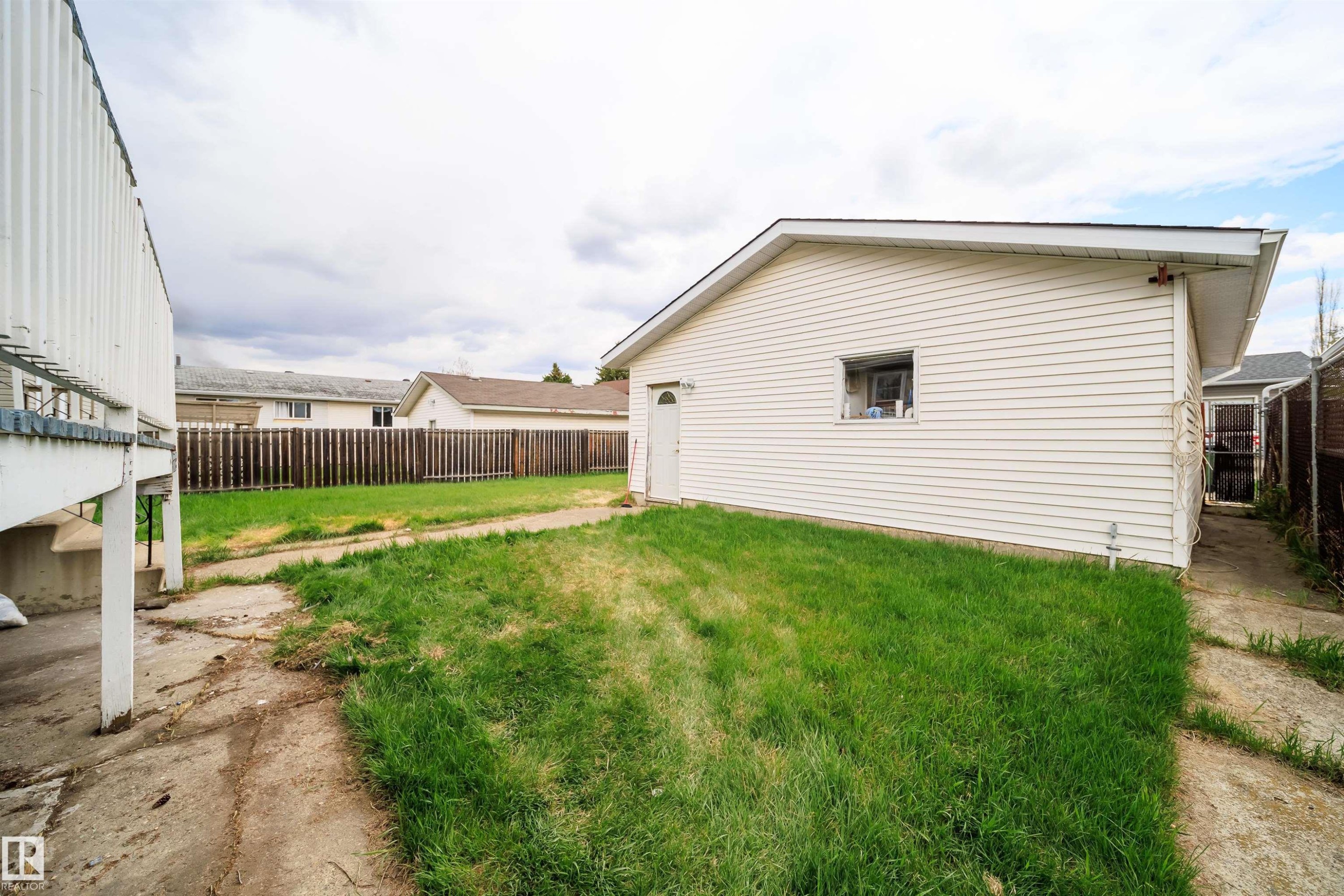 Detached garage featuring horizontal siding and a side entry door - 1771 37 Street, Edmonton, AB - Outdoor With Exterior
