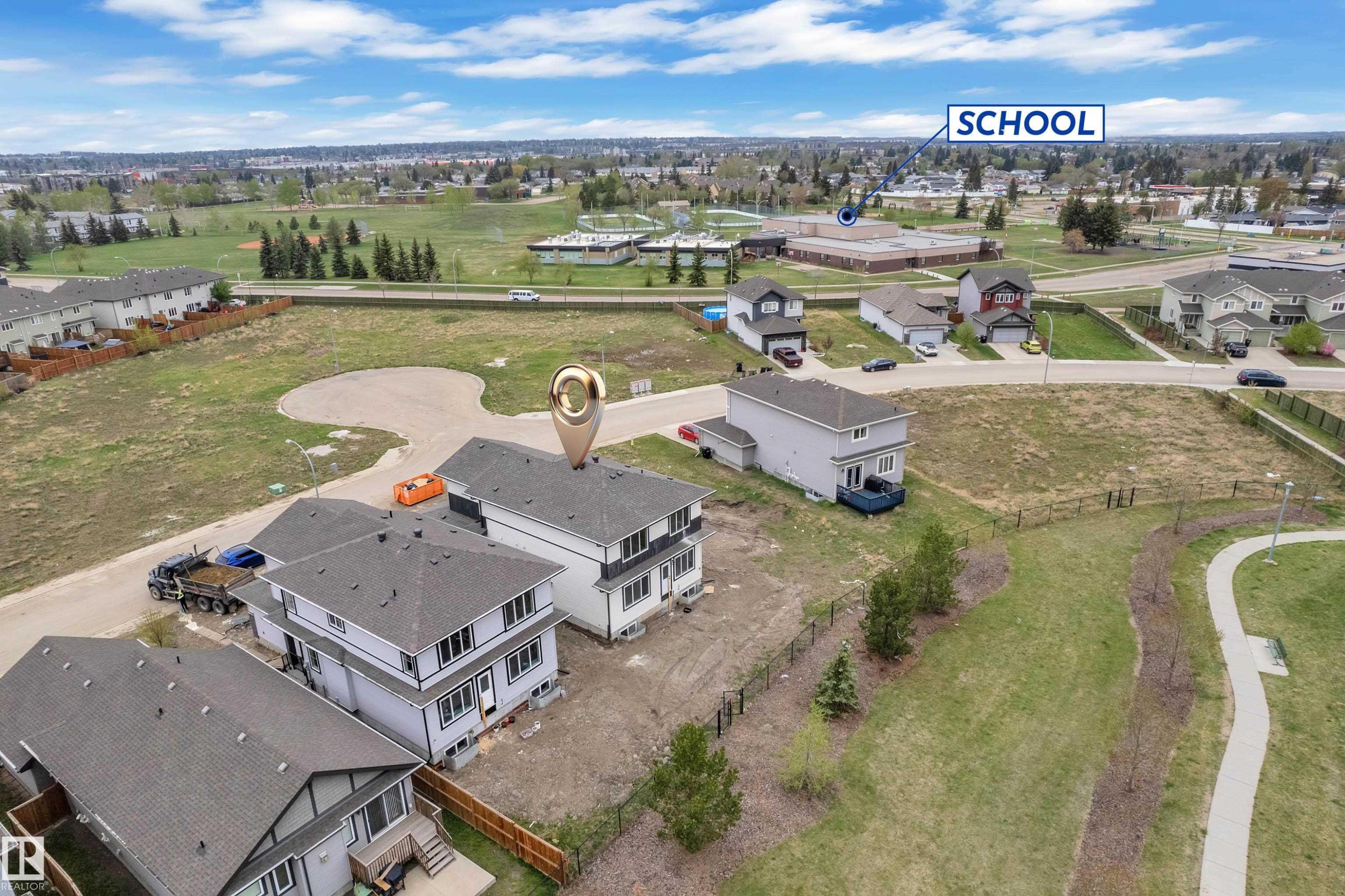 Aerial perspective showcasing multiple properties and neighborhood amenities - 12623 44 Street, Edmonton, AB
