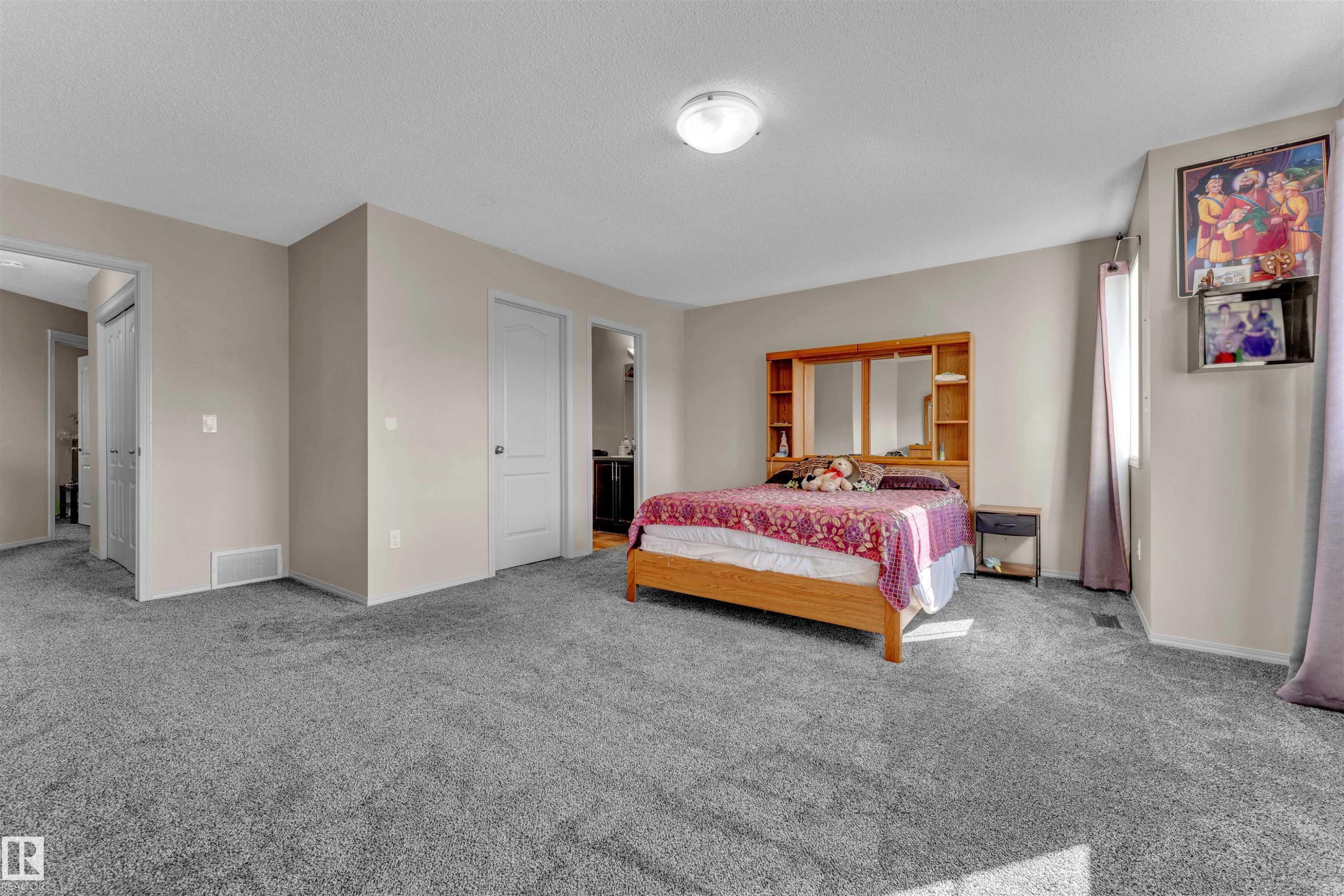 Carpeted bedroom with baseboards and a textured ceiling - 6152 13 Avenue, Edmonton, AB - Indoor Photo Showing Bedroom