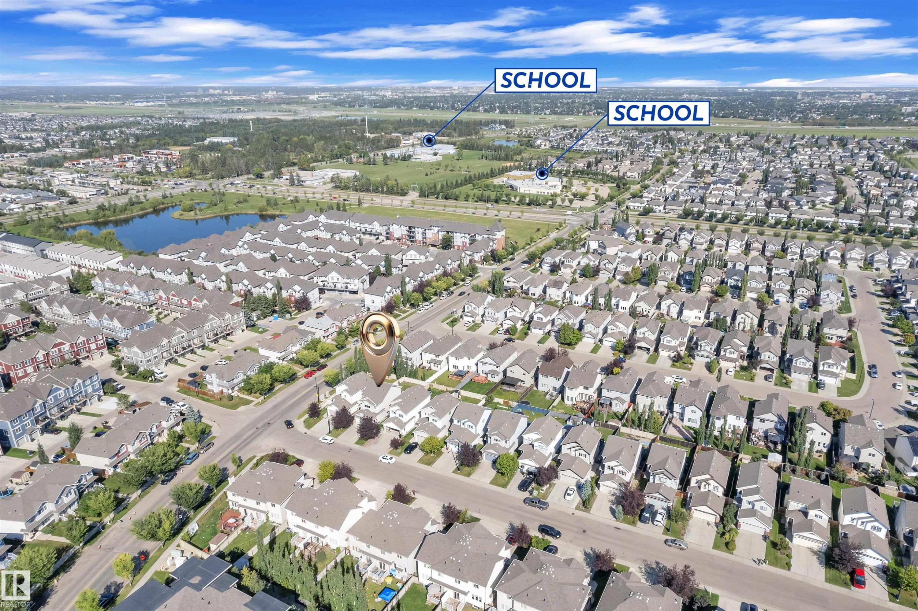 View of property location featuring nearby suburban area and a large body of water - 6152 13 Avenue, Edmonton, AB - Outdoor With View