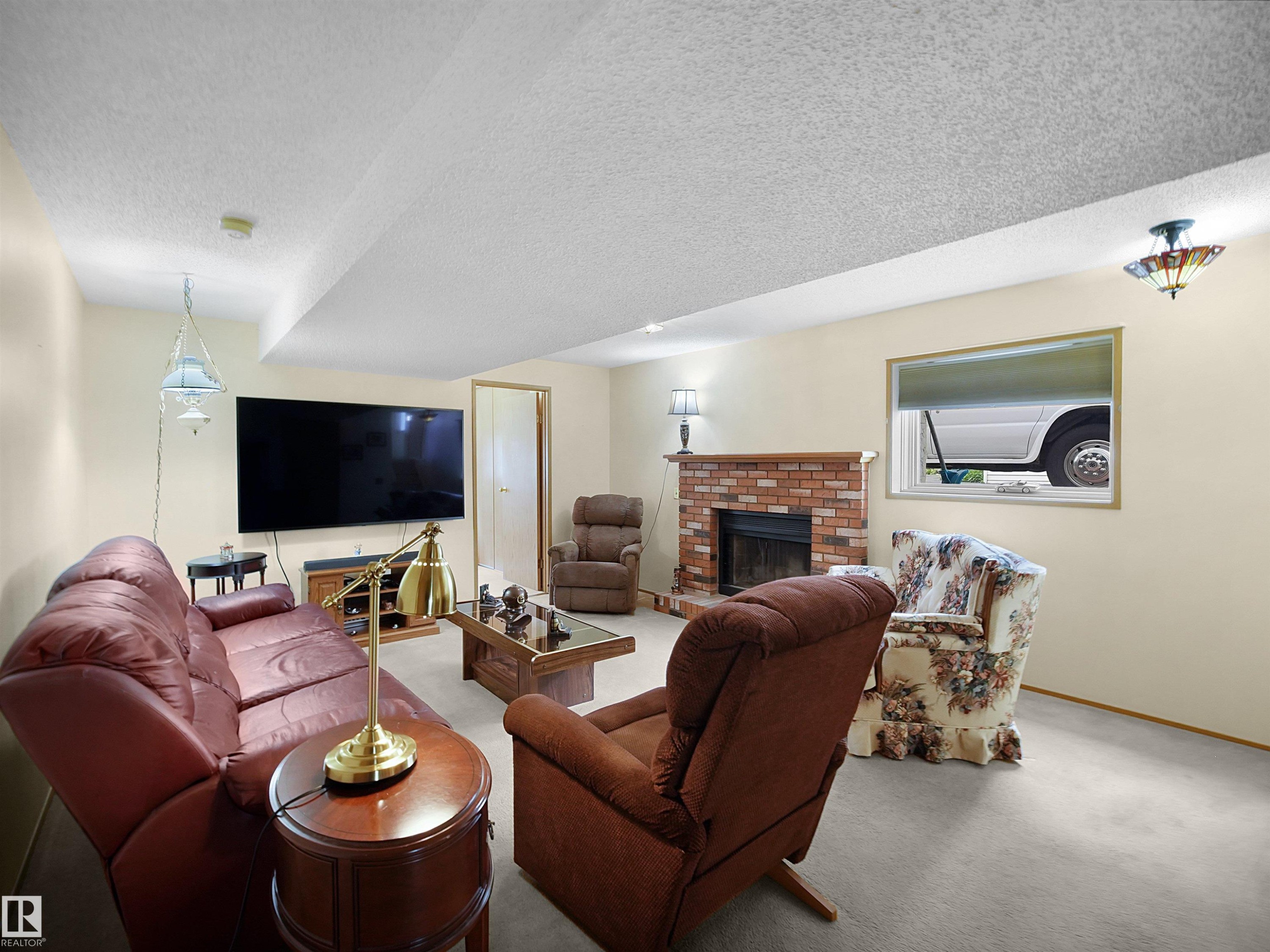 10711 24 Avenue, Edmonton, AB - Indoor Photo Showing Living Room With Fireplace