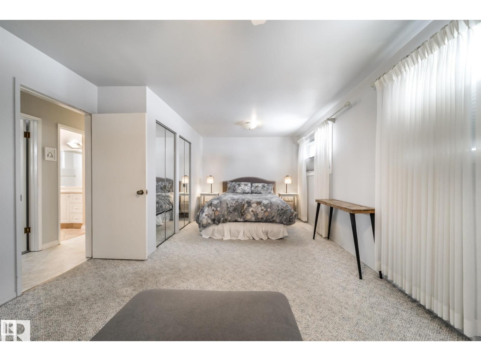 Carpeted bedroom with mirrored closet doors and recessed lighting - 10231 46 Street, Edmonton, AB