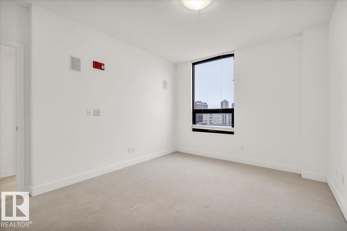 LARGE PRIMARY BEDROOM WITH BUILT IN SPEAKERS - 503 10028 119 Street, Edmonton, AB - Indoor Photo Showing Other Room