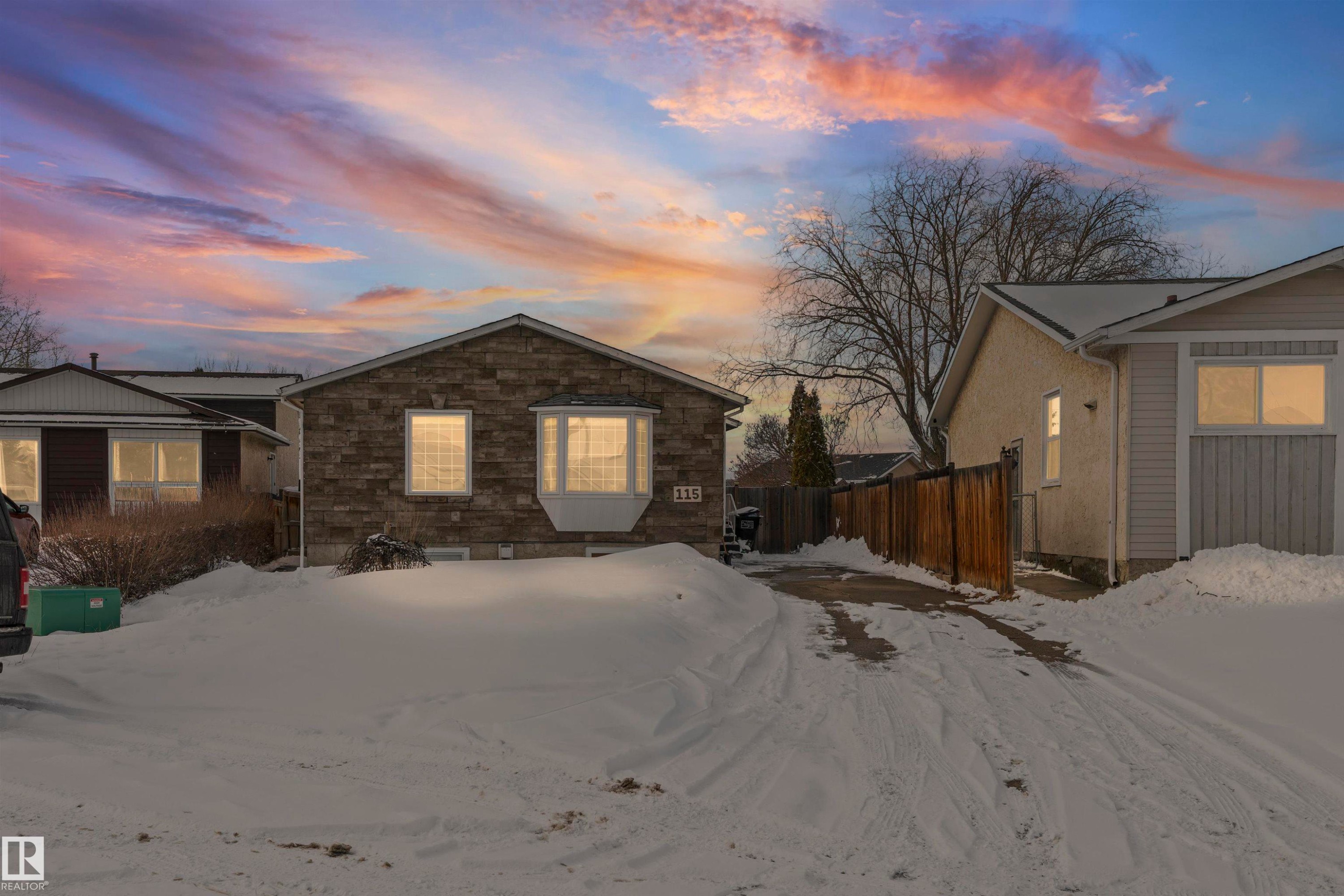 Stone-faced exterior featuring a prominent bay window - 115 Warwick Road, Edmonton, AB - Outdoor