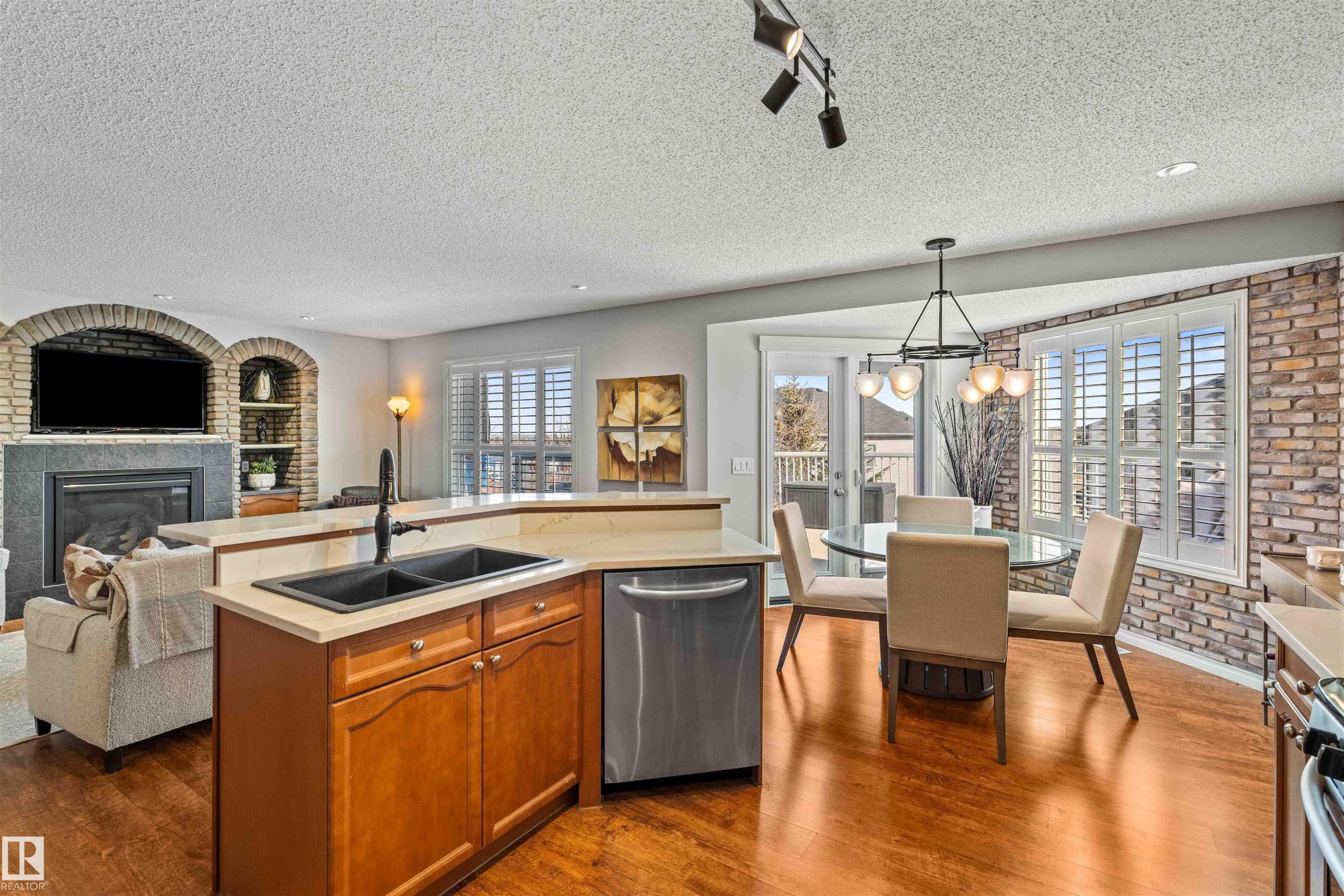 68 Greystone Crescent, Spruce Grove, AB - Indoor Photo Showing Kitchen With Fireplace With Double Sink