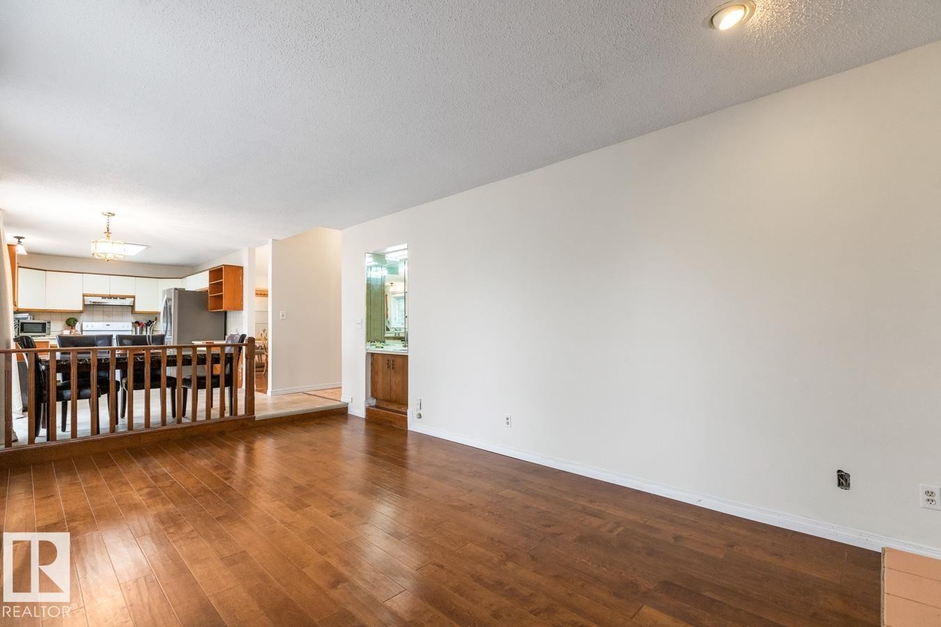 Wood-finish flooring throughout the main living area - 4340 33 Street, Edmonton, AB - Indoor