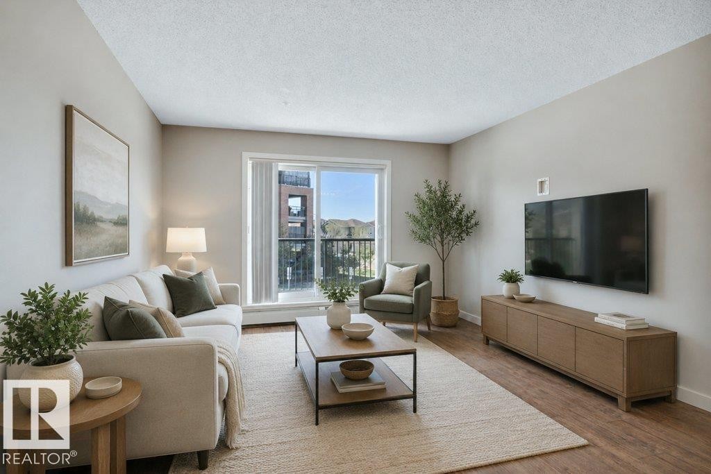 206 5510 Schonsee Drive, Edmonton, AB - Indoor Photo Showing Living Room