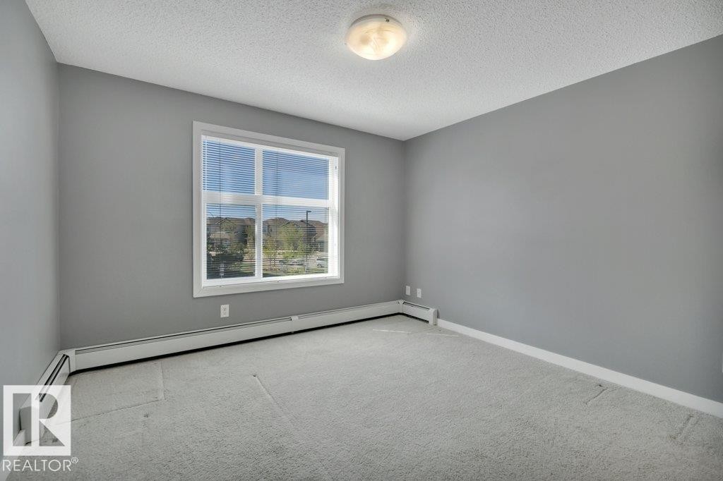 206 5510 Schonsee Drive, Edmonton, AB - Indoor Photo Showing Other Room