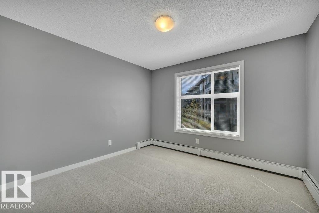 206 5510 Schonsee Drive, Edmonton, AB - Indoor Photo Showing Other Room