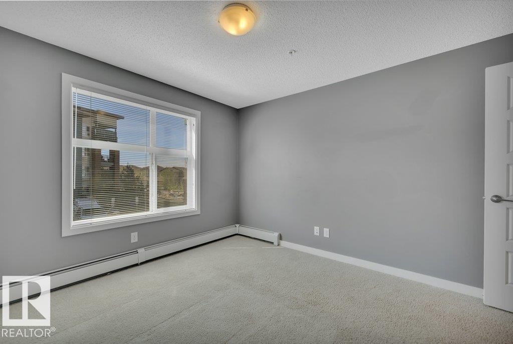 206 5510 Schonsee Drive, Edmonton, AB - Indoor Photo Showing Other Room