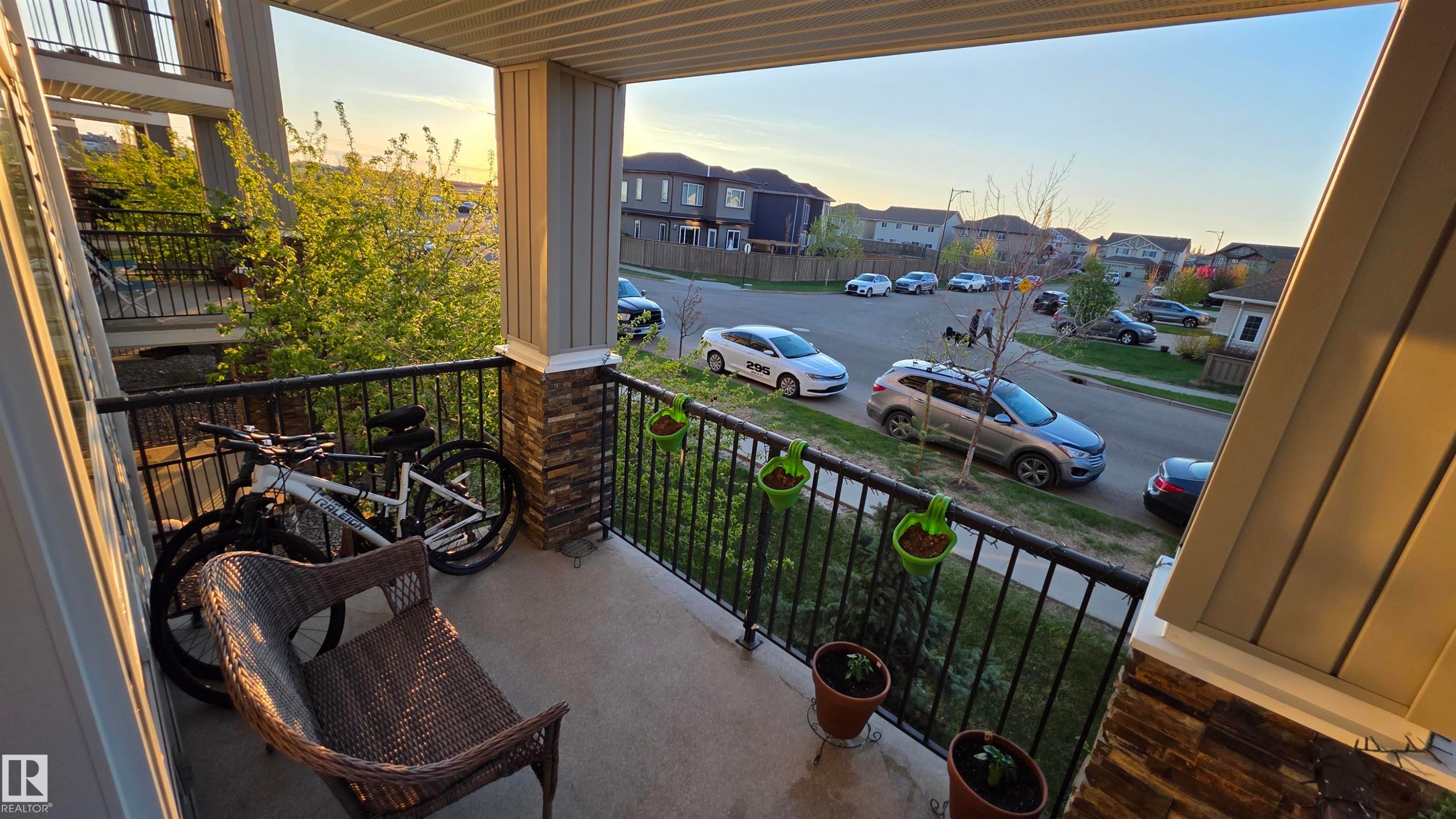 Private outdoor balcony featuring durable concrete flooring and a black wrought-iron railing - 1228 9363 Simpson Drive, Edmonton, AB - Outdoor With Exterior
