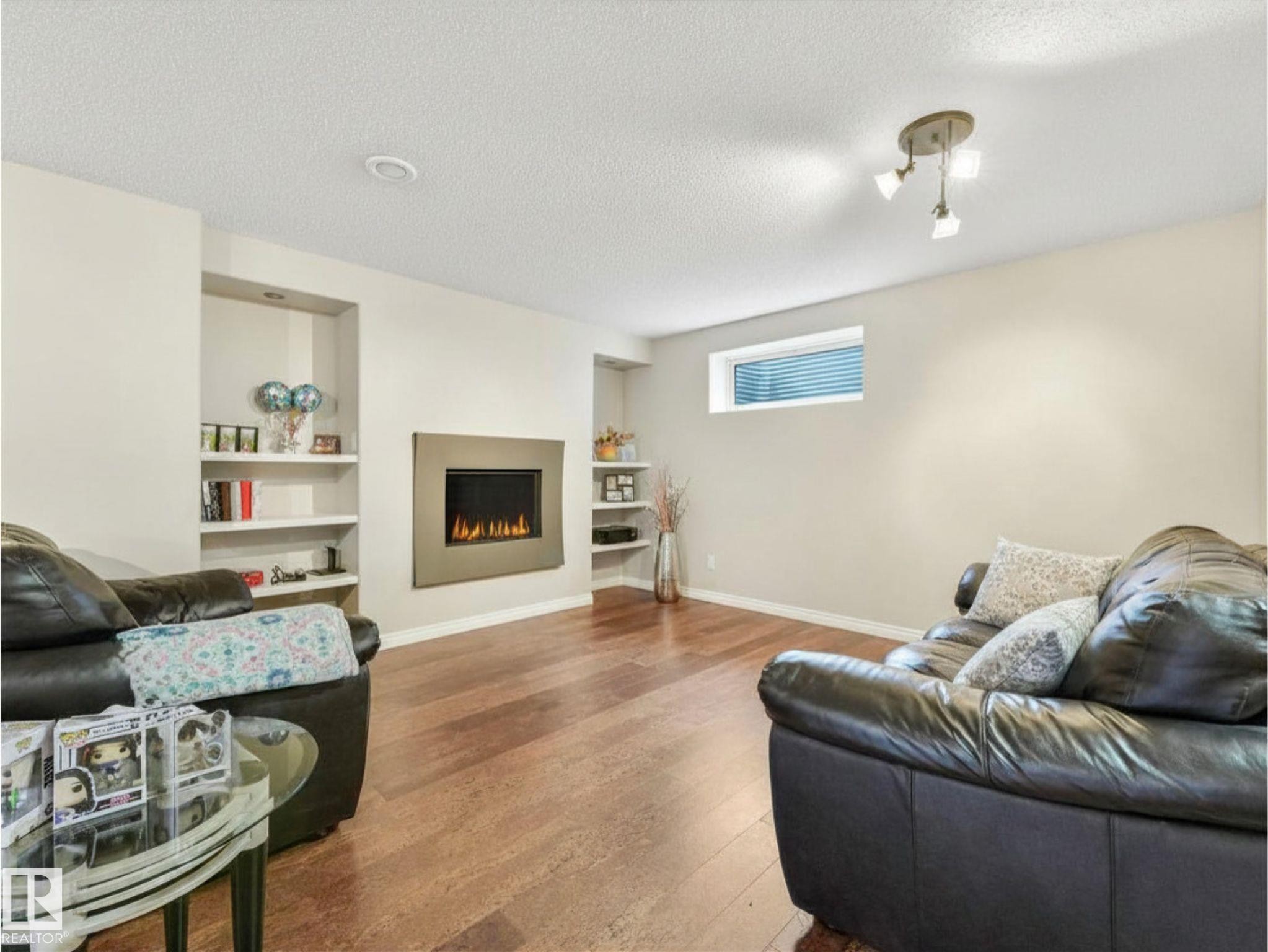 20853 92A Avenue Nw, Edmonton, AB - Indoor Photo Showing Living Room With Fireplace
