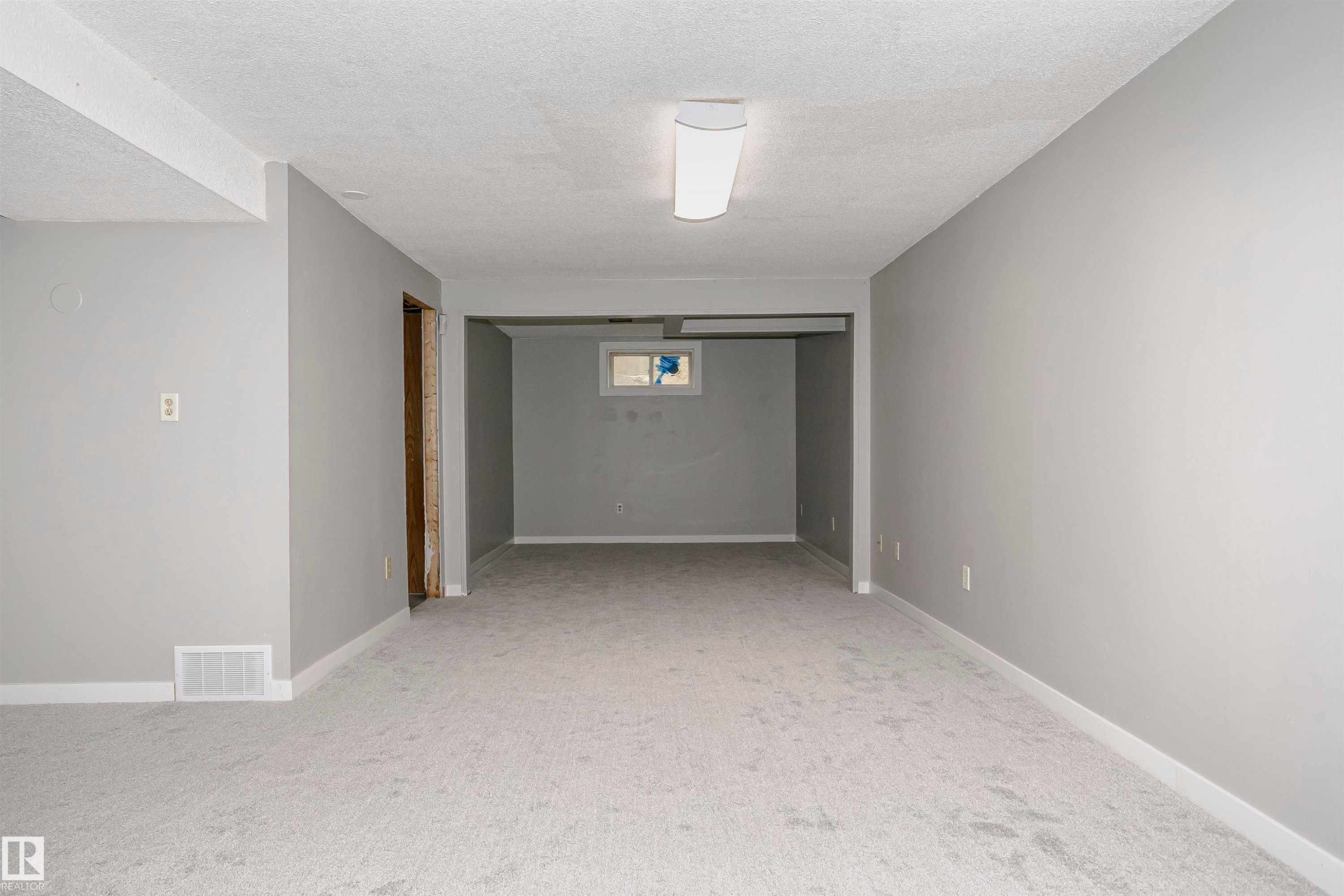 Huge family room with new plush carpet. Lots of room to add bedroom 5 at the end with a window if desired. - 11436 161 Avenue, Edmonton, AB - Indoor Photo Showing Other Room