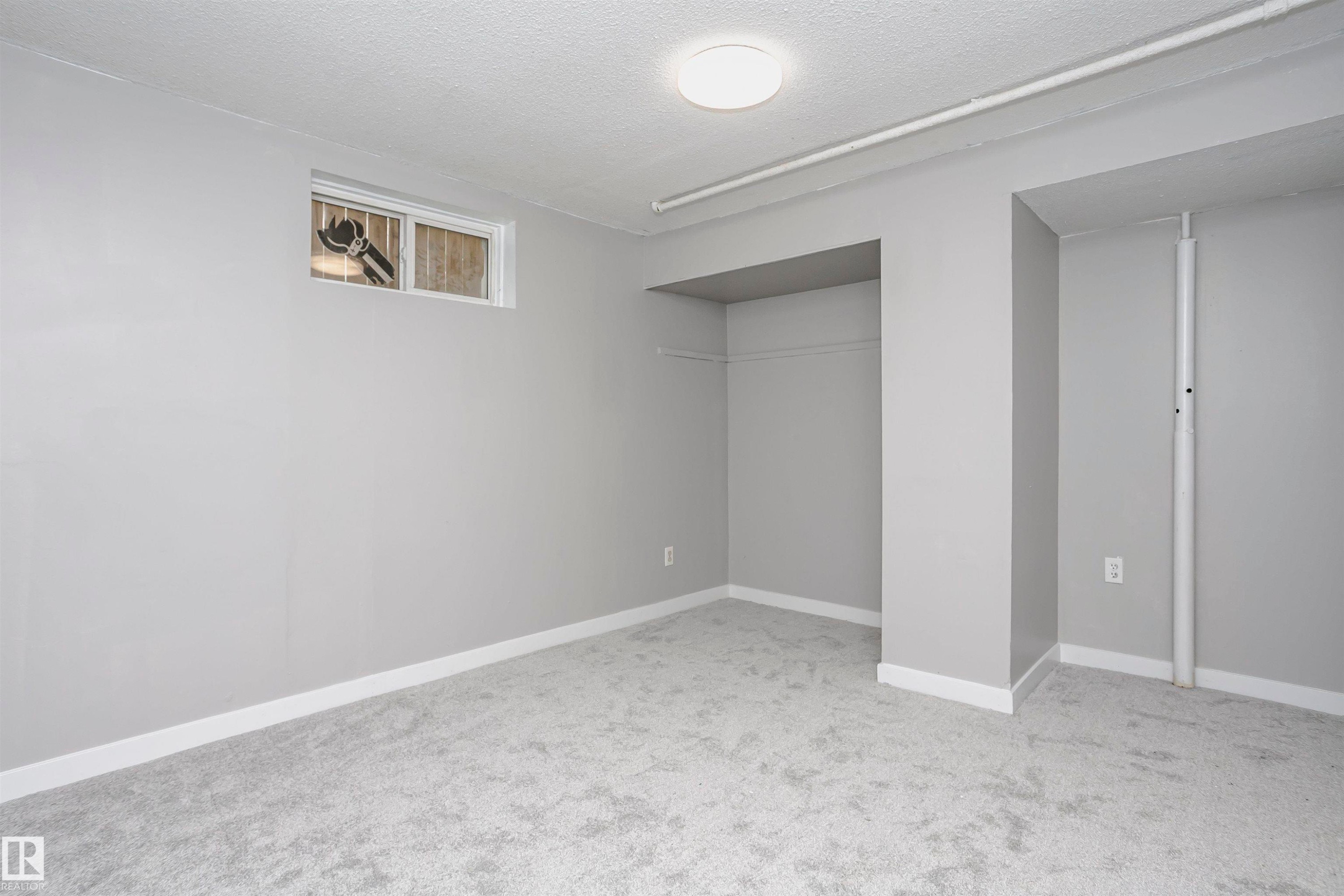 Bedroom 4 in basement with new plush carpet and closet areas. - 11436 161 Avenue, Edmonton, AB - Indoor Photo Showing Other Room