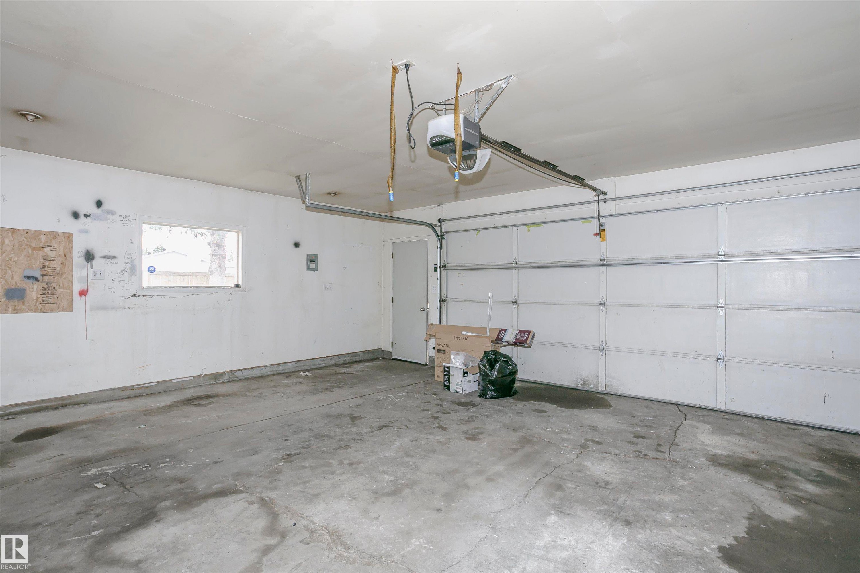 Spacious double detached garage is fully insulated and drywalled with an overhead gas heater. - 11436 161 Avenue, Edmonton, AB - Indoor Photo Showing Garage