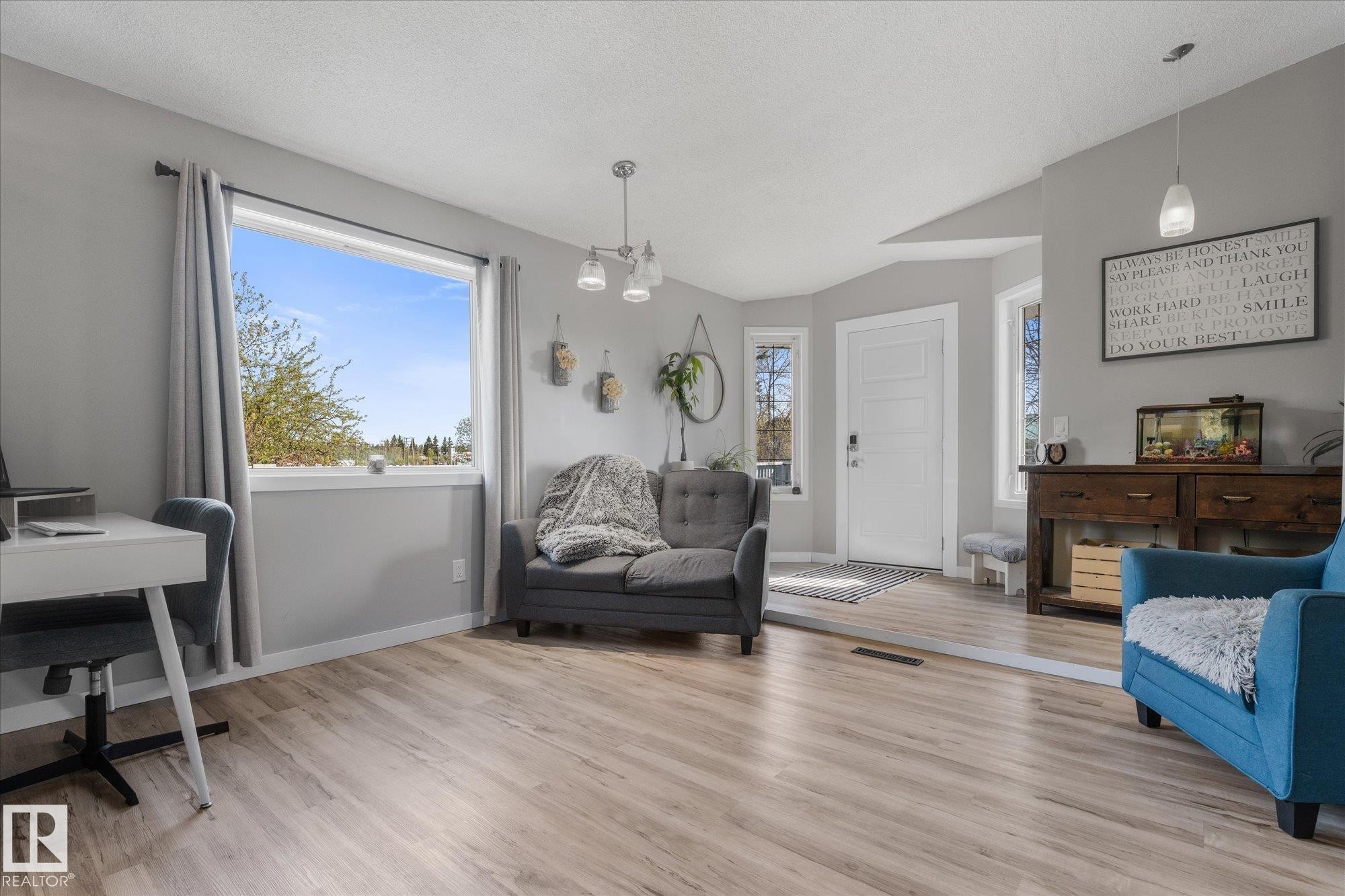 Bright interior space featuring light wood-finish flooring and neutral wall tones - 4759 48 Street, Onoway, AB - Indoor Photo Showing Living Room
