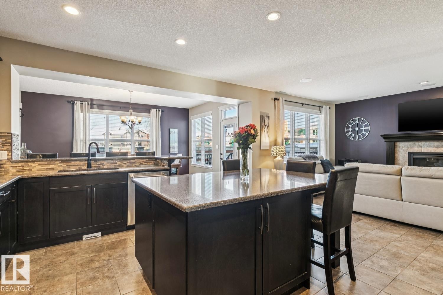3673 Atkinson Loop, Edmonton, AB - Indoor Photo Showing Kitchen With Fireplace With Double Sink