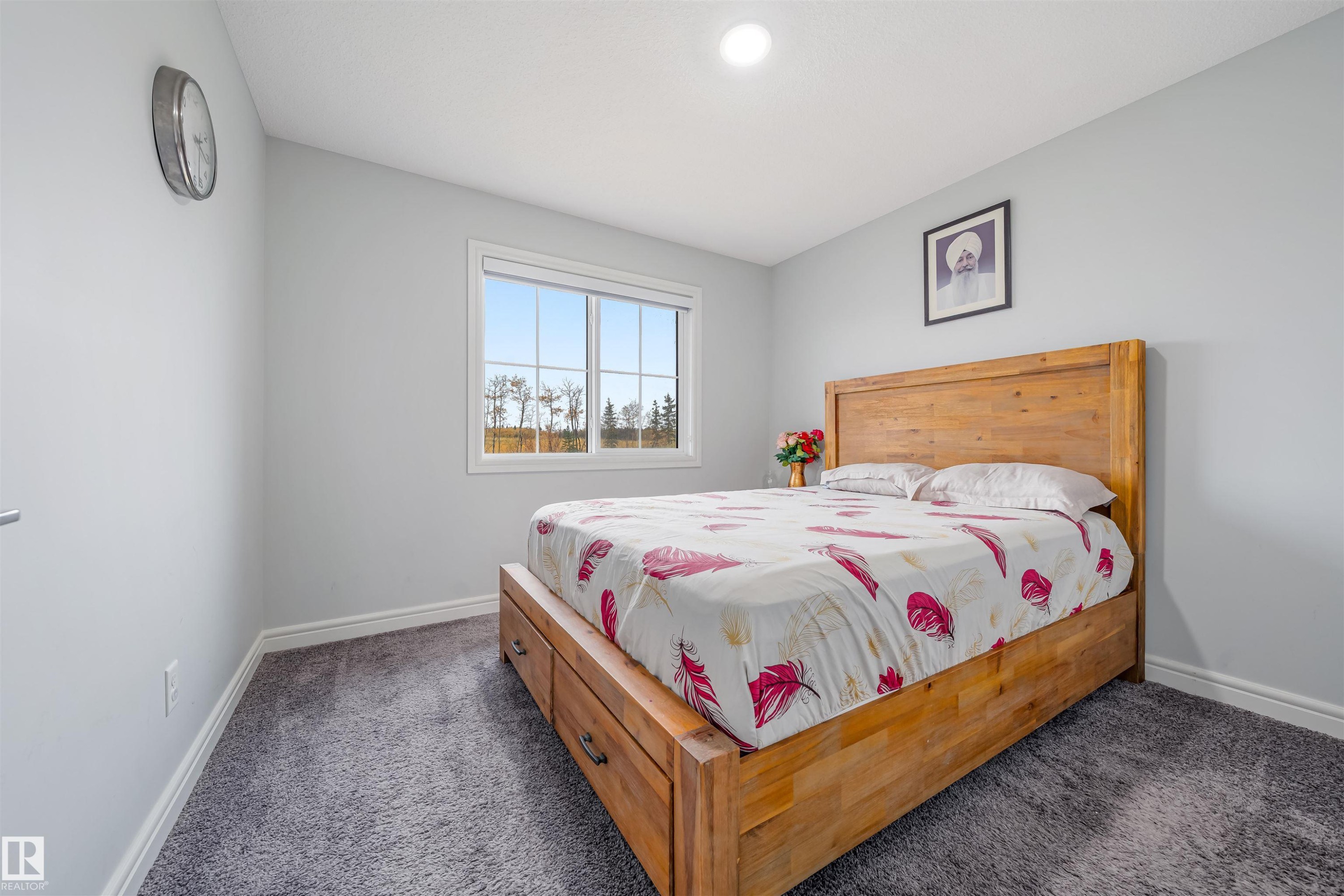 Bedroom featuring light gray wall paint, gray carpeting, and white baseboards - 1024 Daniels Loop, Edmonton, AB - Indoor Photo Showing Bedroom