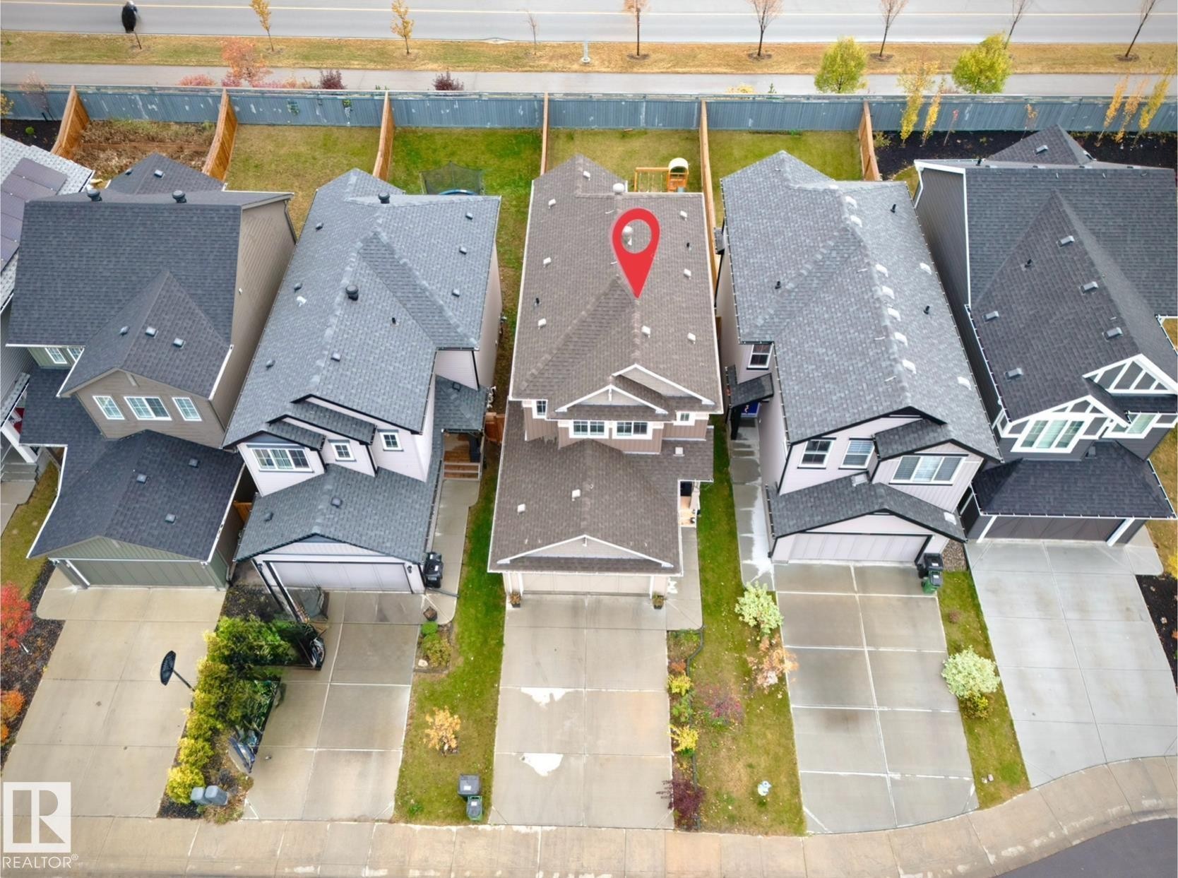 Contemporary two-story home featuring a dark shingle roof and light-toned siding - 1024 Daniels Loop, Edmonton, AB - Outdoor