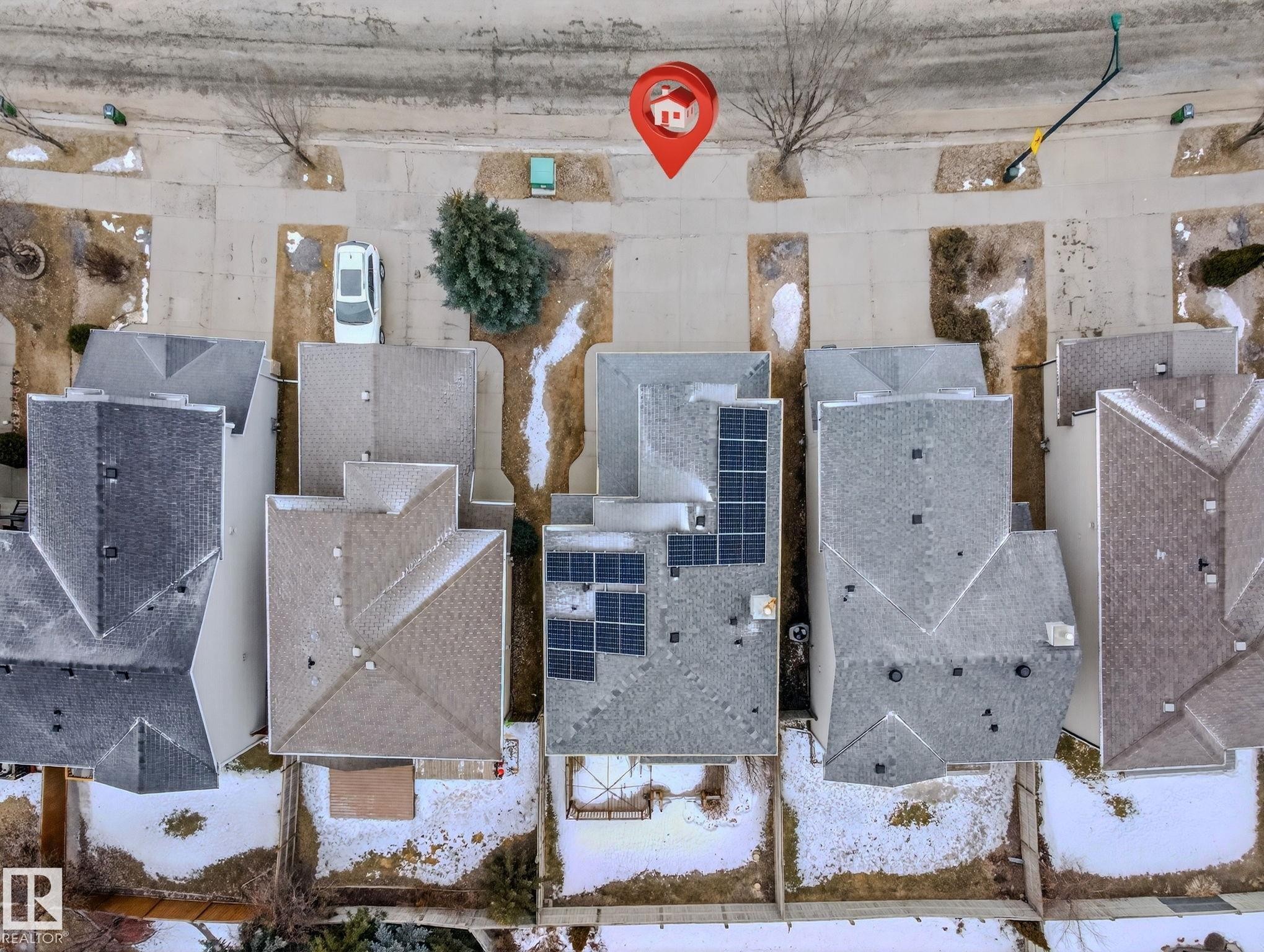 Residential property with an asphalt shingle roof, solar panel array, and concrete driveway - 978 Rutherford Road Sw, Edmonton, AB - Outdoor