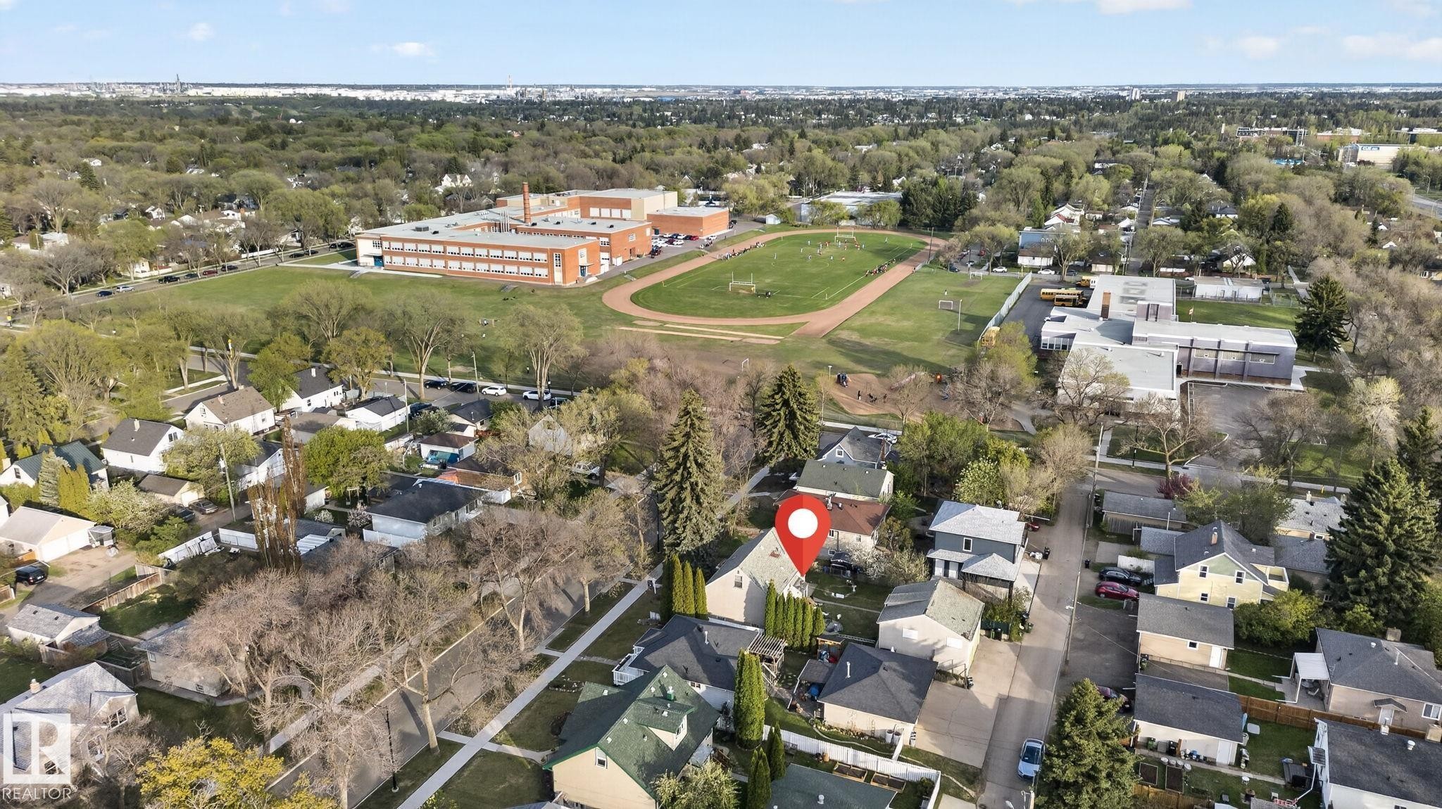 Residential neighborhood featuring a variety of detached homes and mature trees - 11614 70 Street, Edmonton, AB