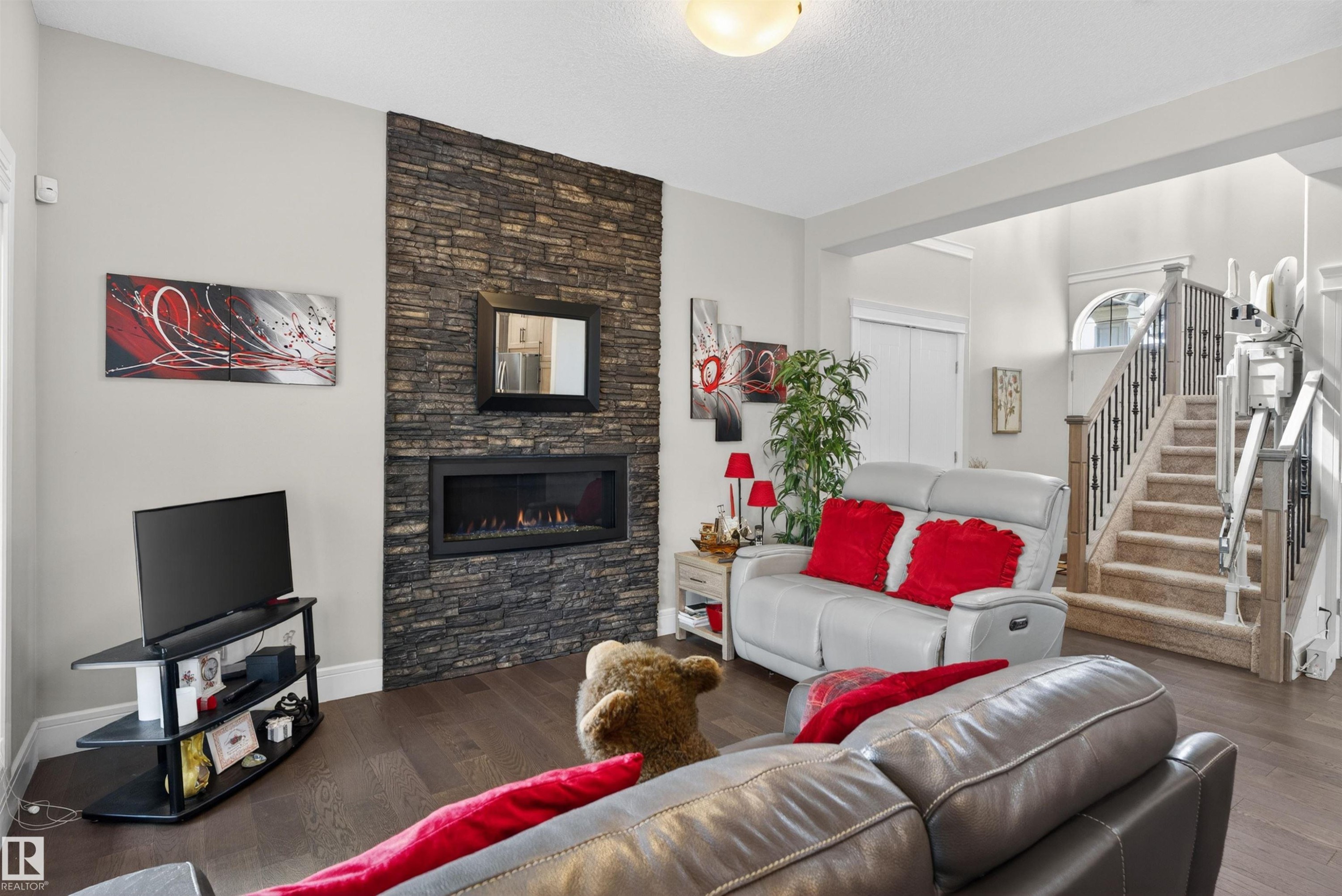 1 1030 Connelly Way, Edmonton, AB - Indoor Photo Showing Living Room With Fireplace