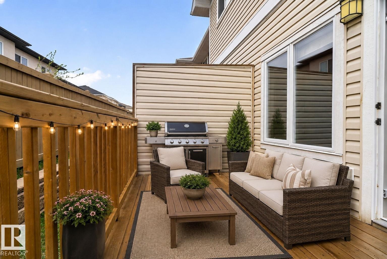 Outdoor deck with natural wood flooring - 11 450 Mcconachie Way, Edmonton, AB - Outdoor With Exterior